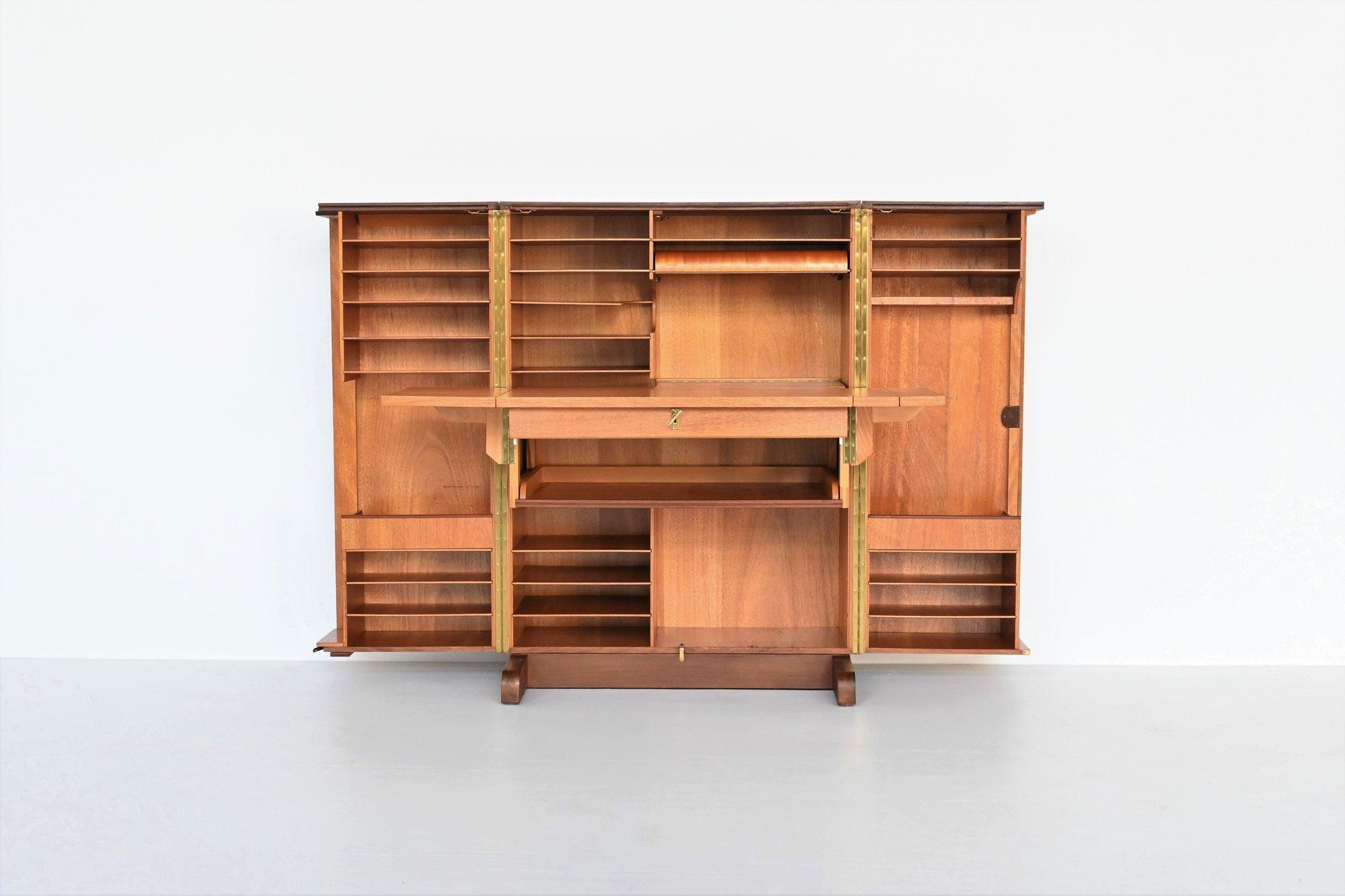 Stunning foldable writing desk designed by Mummenthaler & Meier, Switzerland 1950. This model is called “Magic Box” and the name says it all. When you open the cabinet, it shows a very nice working space with a plenty of storage options. By pulling