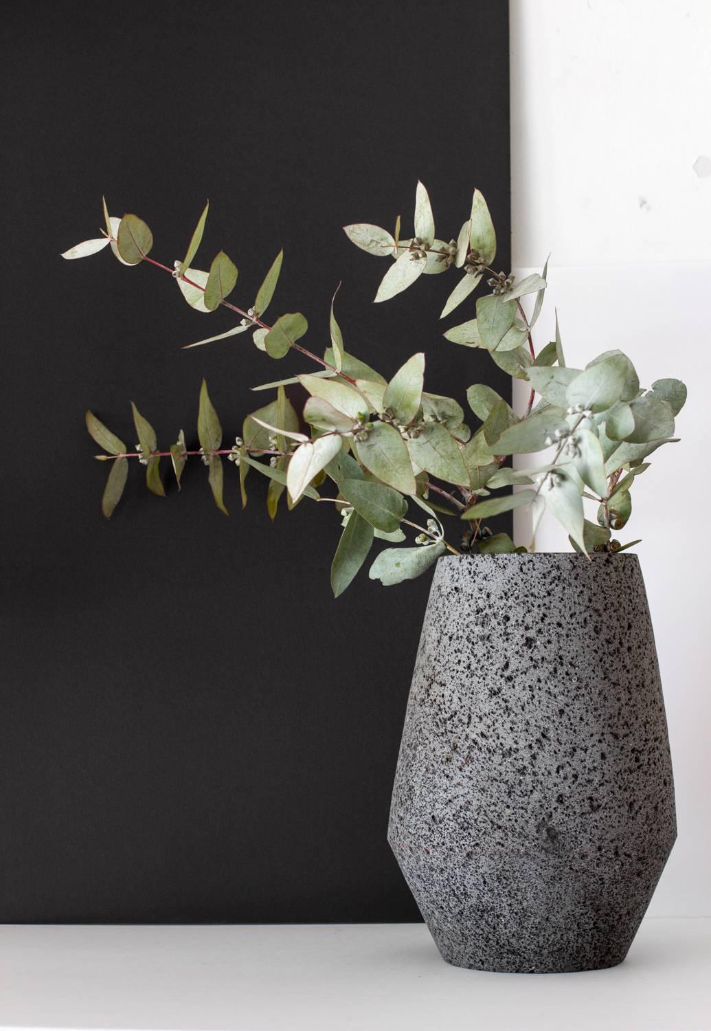 This contemporary vase is design by Ayres and hand-carved in volcanic stone for artisans in Puebla, México, for it´s simple and aesthetic design is one of a kind piece.