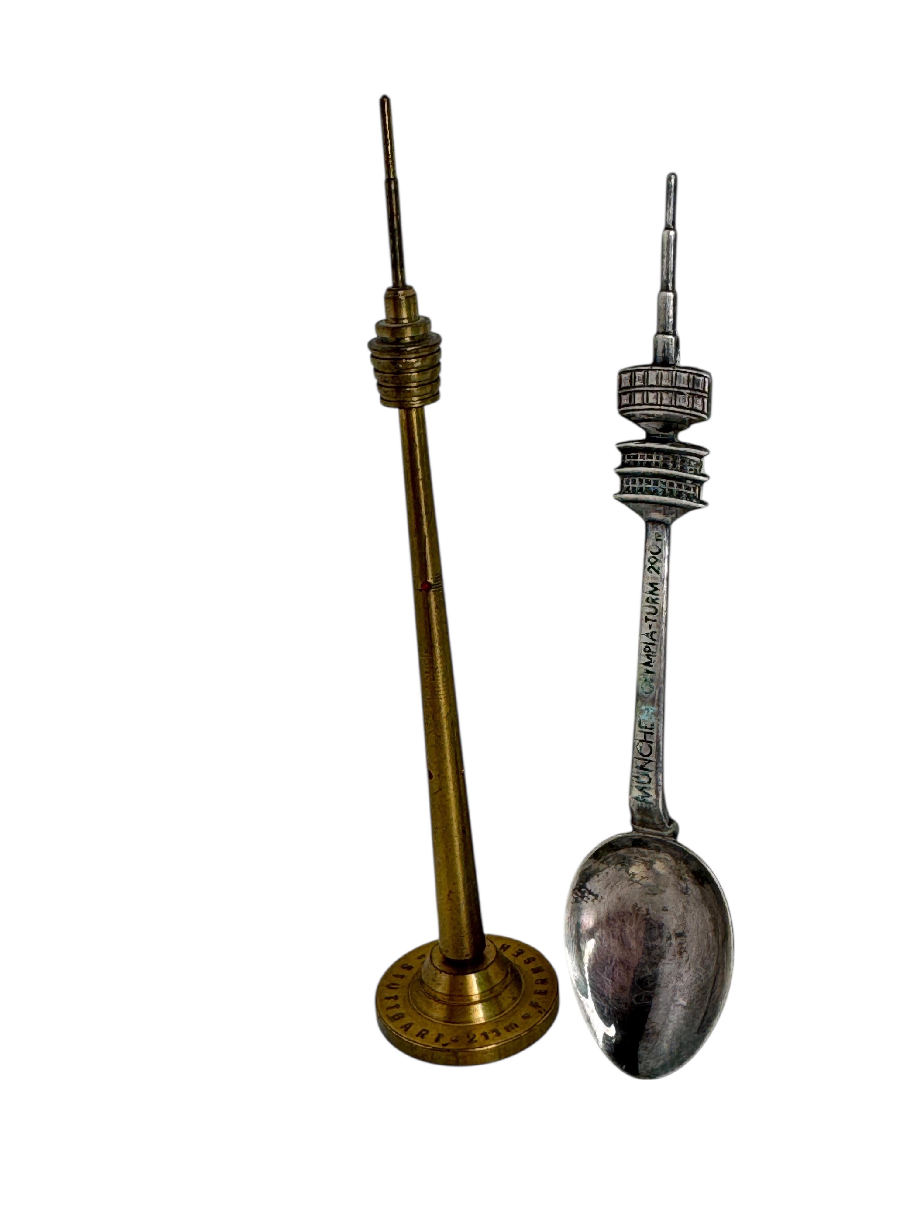1970s German Souvenir Set – Munich Olympic TV Tower Spoon & Stuttgart TV Tower Pen
A charming pair of mid-20th-century German souvenirs dating to the 1970s, evocative of the era’s fascination with modern architecture and design.
This set