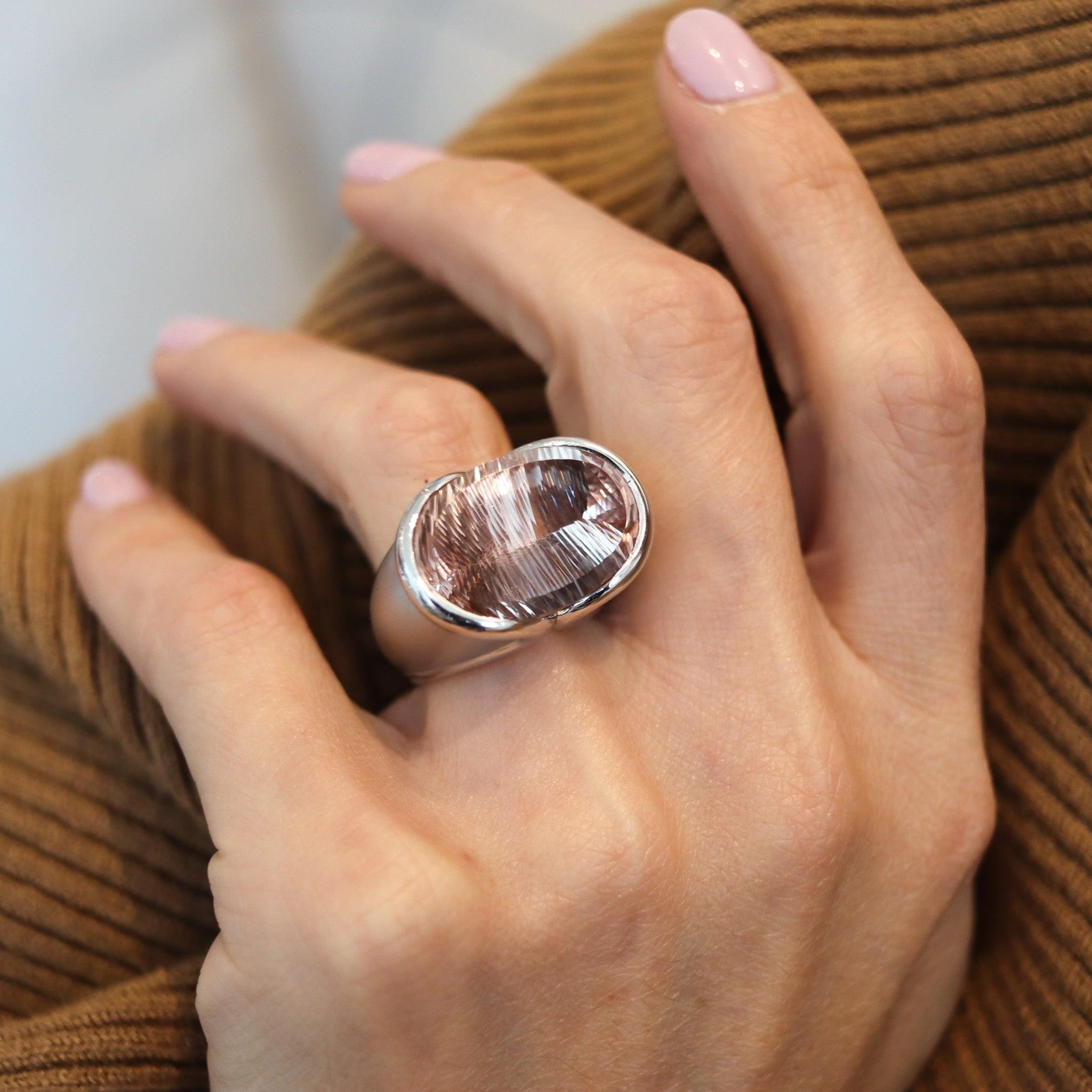 A sculptural ring with an Atelier Munsteiner cut morganite.

This is a fabulous sculptural cocktail ring, created in Germany with modernist patterns back in the 1990's. The sculptural ring was carefully crafted in solid white gold of 18 karats with