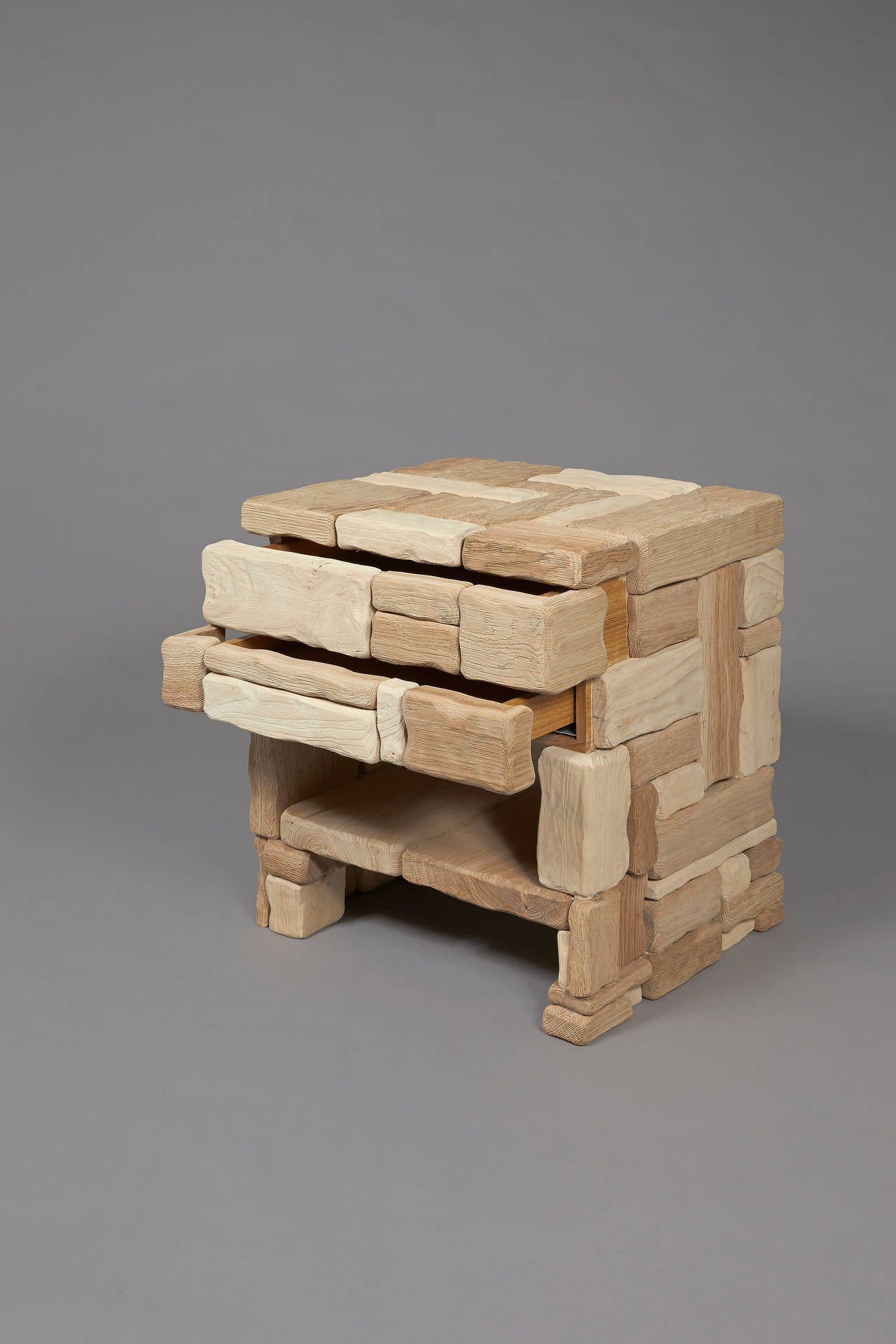 Mur.
Cat-Berro edition 2013.
Side unit with two drawers. One niche.
Scarified oak and elmwood.
Measures: L 18”, H 24.5”, D 21.5” cm.
L 45 cm, H 62 cm, P 55 cm.

Signed piece of a limited edition of 18 + 2 AP + 2 P.
Customized size possible.
Delivery