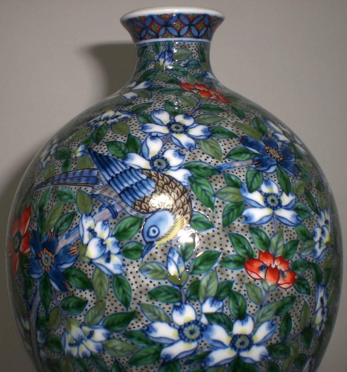 An attractive hand-painted large porcelain vase in a beautiful double gourd shape, this vase is a signature piece by Murakami Genki (1931-2009), a master porcelain artist who lived in the Imari-Arita region of southern island of Kyushu in