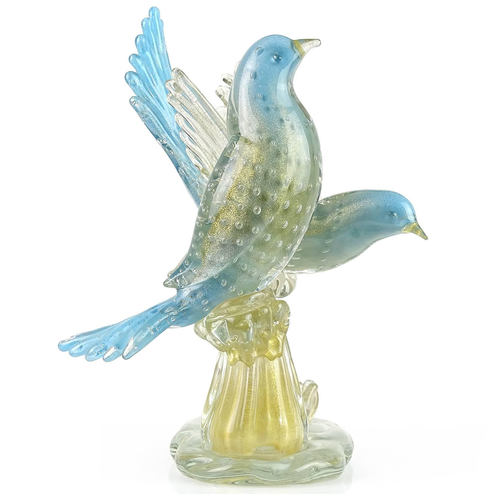 Beautiful large vintage Murano hand blown blue and gold flecks Italian art glass courting birds sculpture on branch. Attributed to designer Alfredo Barbini for the Salviati company, circa 1950s. The wings of one bird have gold leaf, as well as the