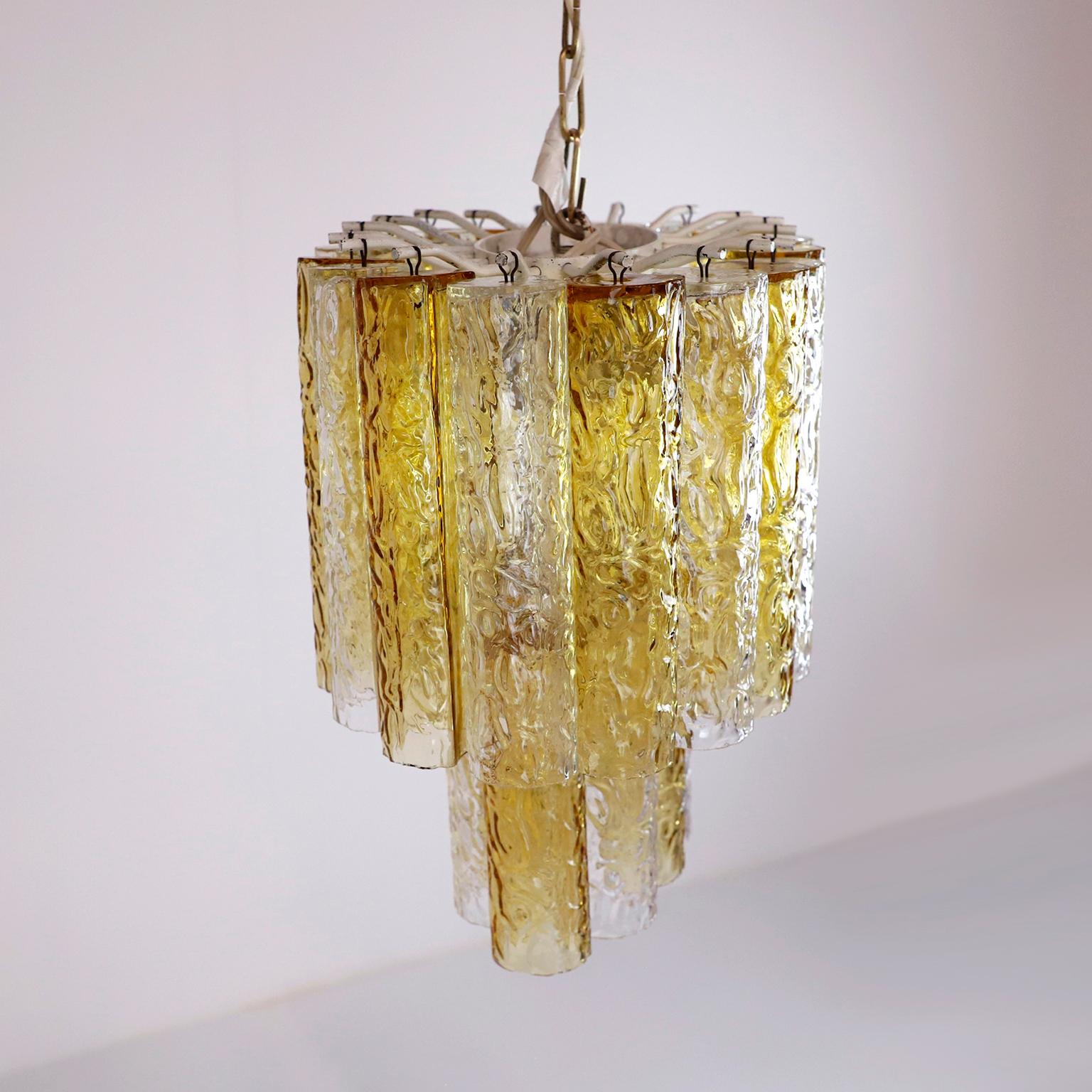 Circa 1970. We offer this Murano Amber and Clear Tronchi Chandelier Venini. The chandelier has a missing piece from the bottom row.