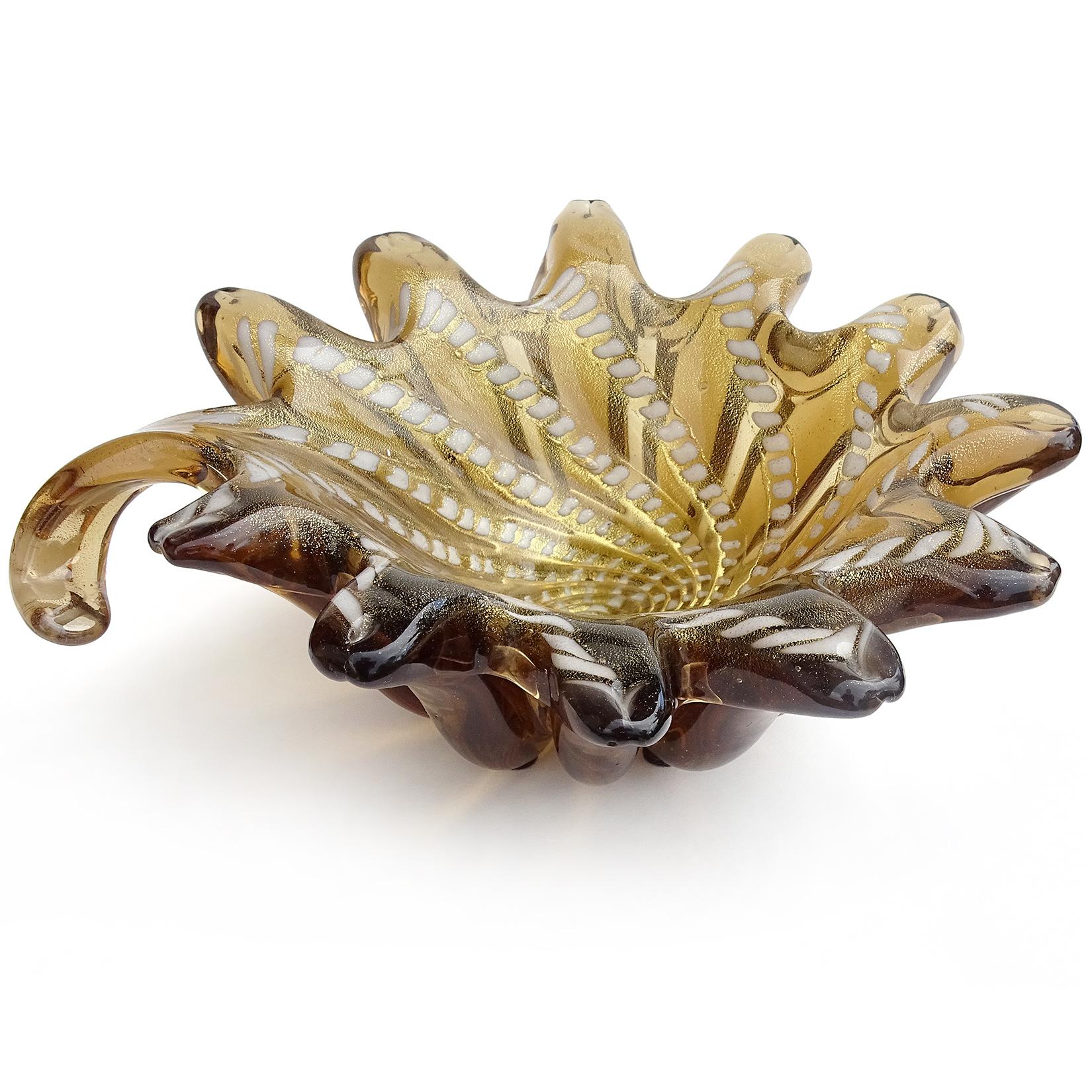 Beautiful and unusual vintage Murano hand blown dark amber, gold flecks, and swirling design Italian art glass bowl. Decorated with white color spots spiraling towards the center. It has 11 pulled pieces along the edge, and a curled tail handle. The