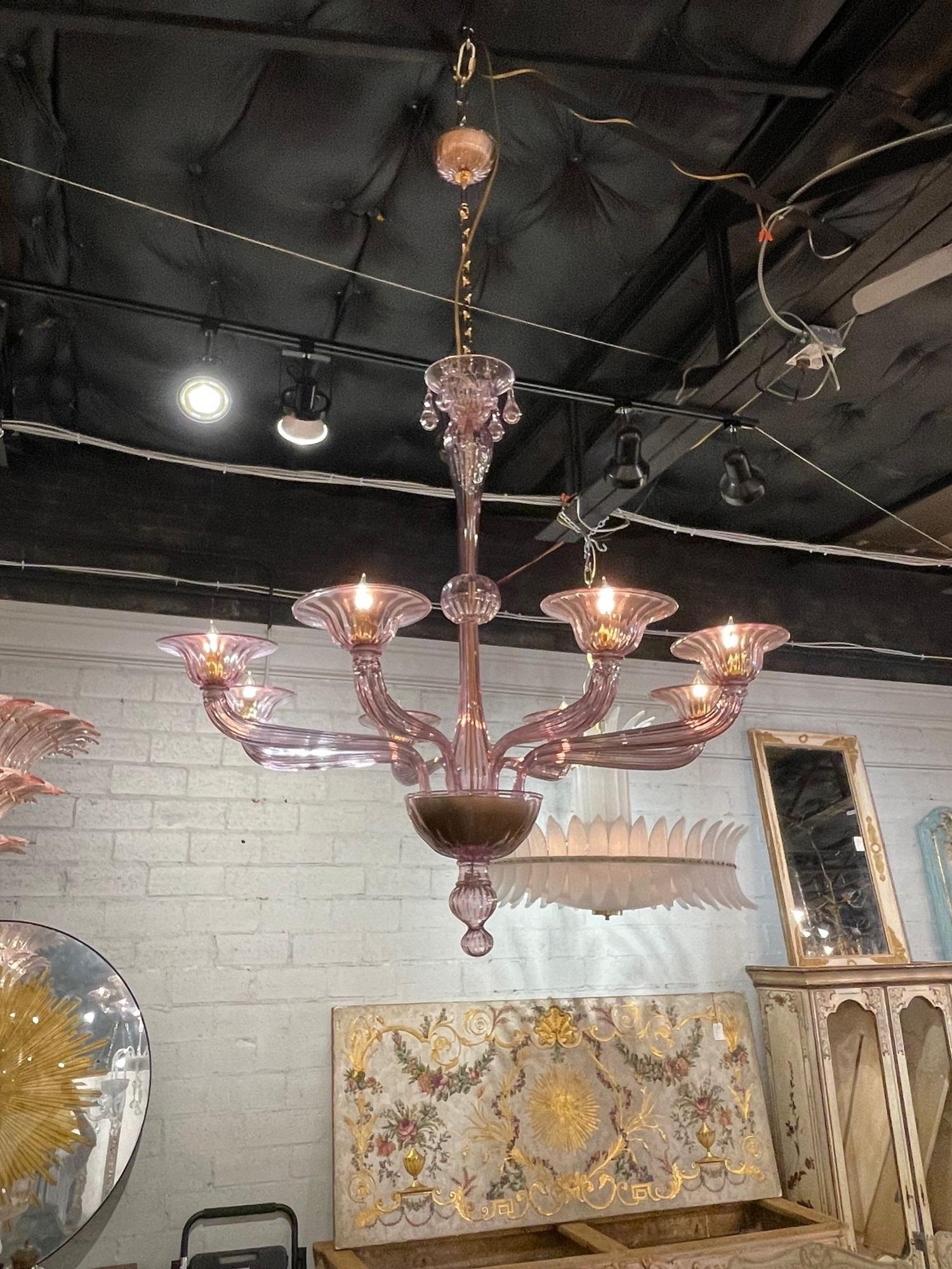 Gorgeous modern Murano amethyst glass 8-light chandelier. Circa 2000. The chandelier has been professionally re-wired, cleaned and is ready to hang. Includes matching chain and canopy.