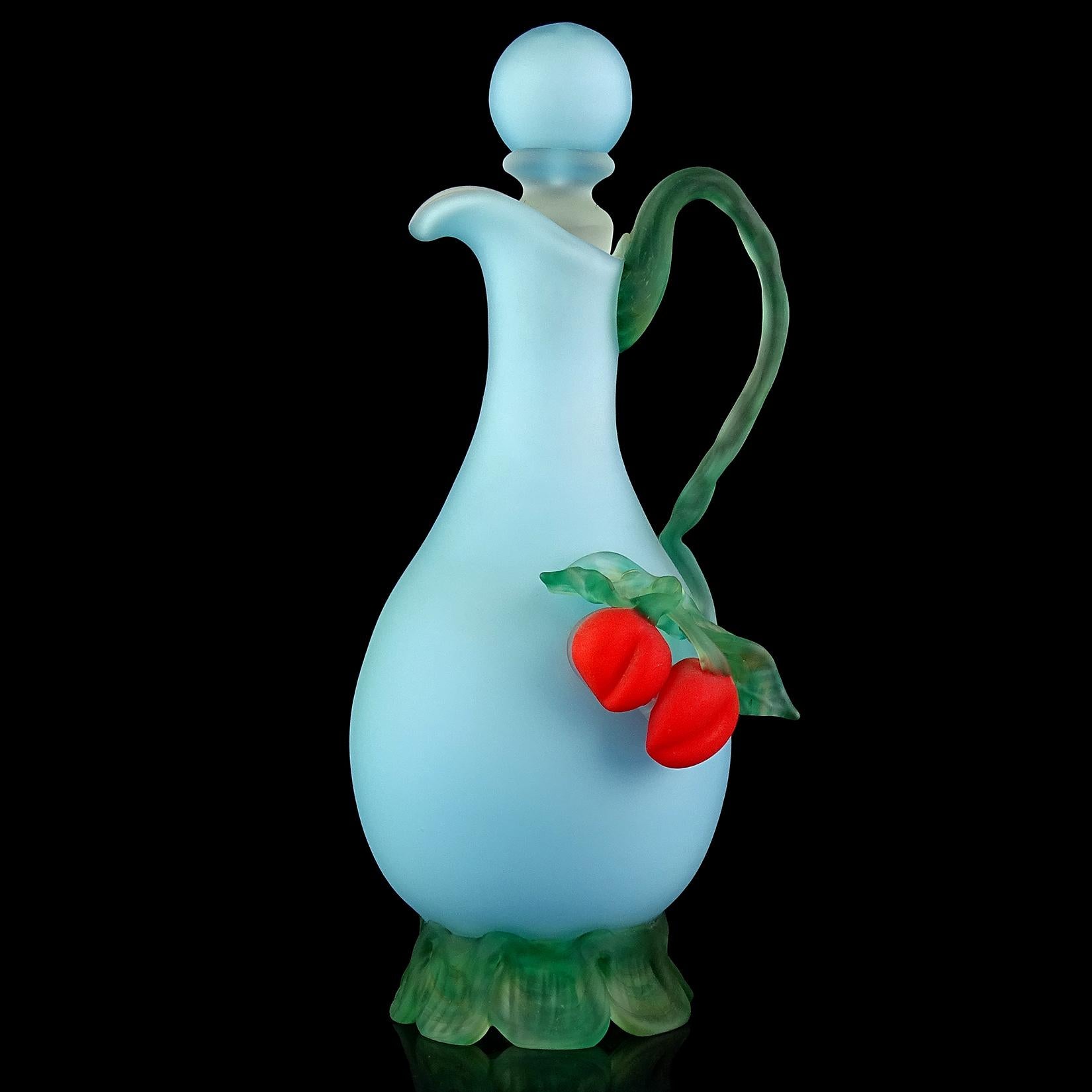 Beautiful Murano hand blown baby blue with applied red cherries Italian satin art glass pitcher / ewer. It has the original stopper, with mottled green vine handle, leafs and crimped base. The piece is circa 1960s-1970s, but created in the style of