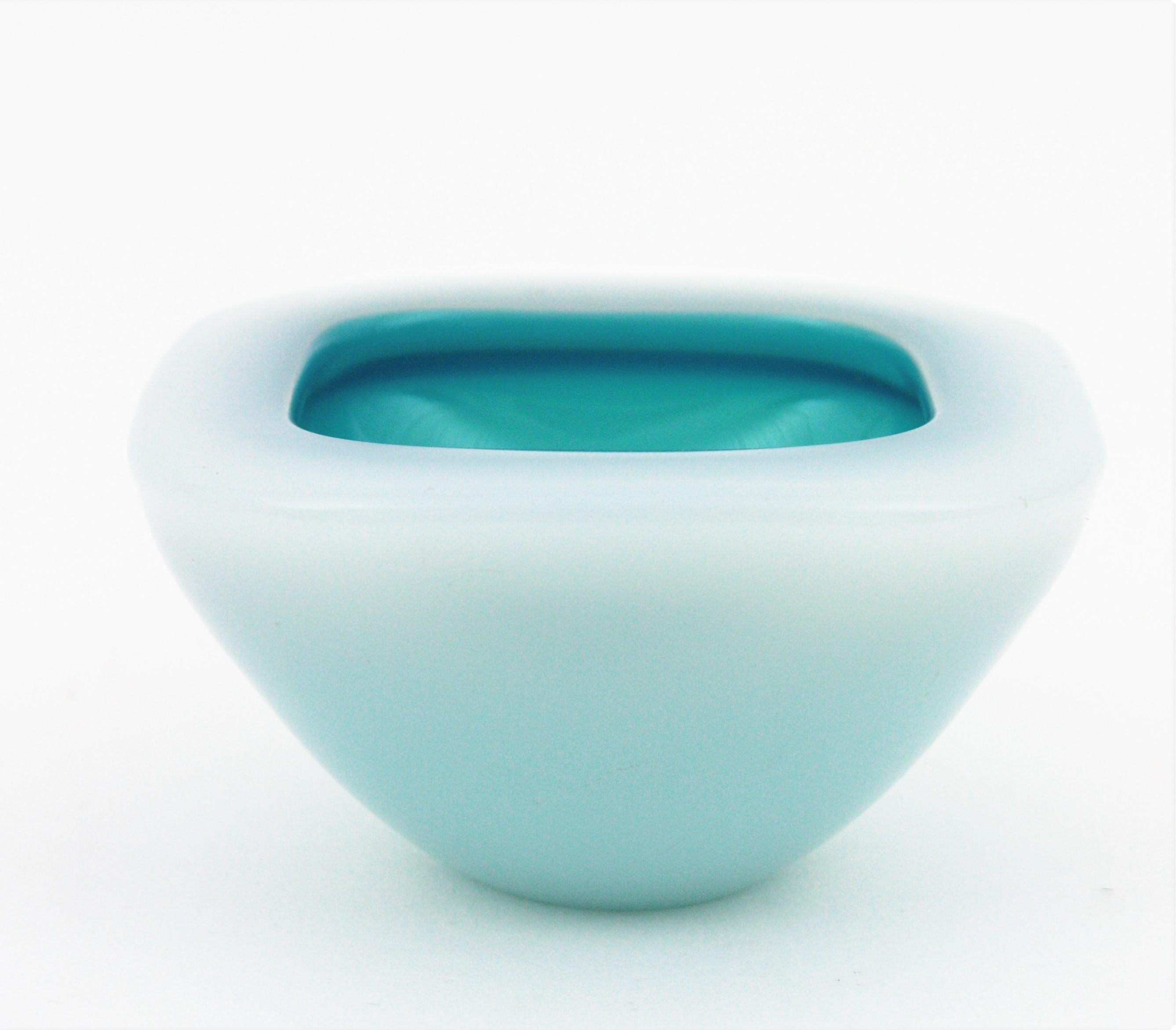 Hand blown Murano glass Sommerso geode bowl in blue and white color attributed to Archimede Seguso, Italy, 1950s.
This alabastro bowl has an eye-catching interior part in blue glass. Lovely to be used as jewelry bowl, rings bowl, ashtray or