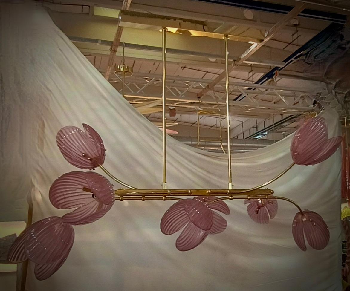 This charming chandelier was made entirely by hand in Murano. Each single leaf is handcrafted in high quality blown Murano glass; that's why each leaf is slightly different from the other. Exciting color, intense pink.

The chandelier is made of a