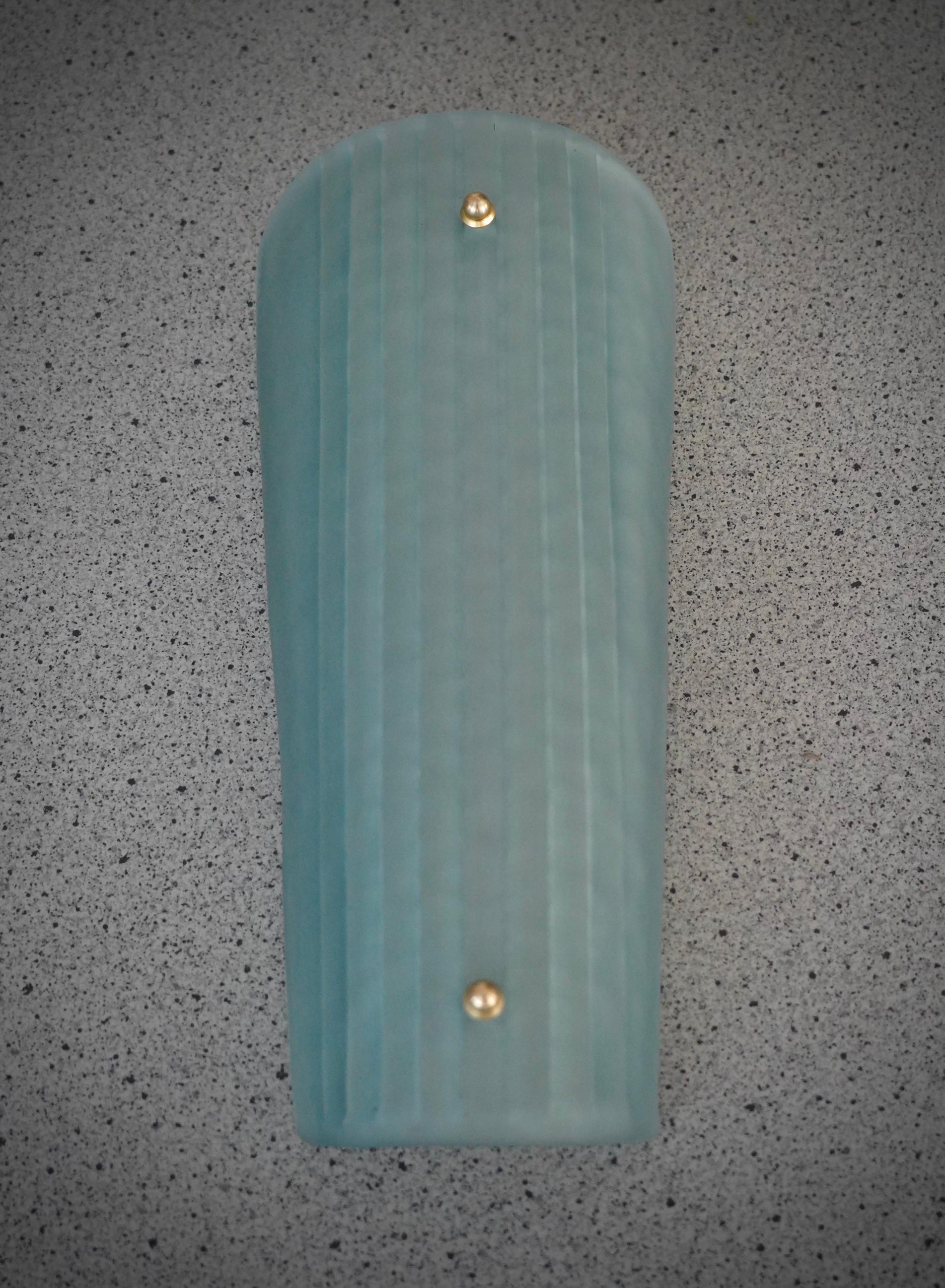 Beautiful assembly for this Murano glass applique. A very particular and rare glass to find, aqua green effect, sandblasted and acid-etched; classic Murano style.

The applique is composed of a beautiful striped and curved glass to form a
