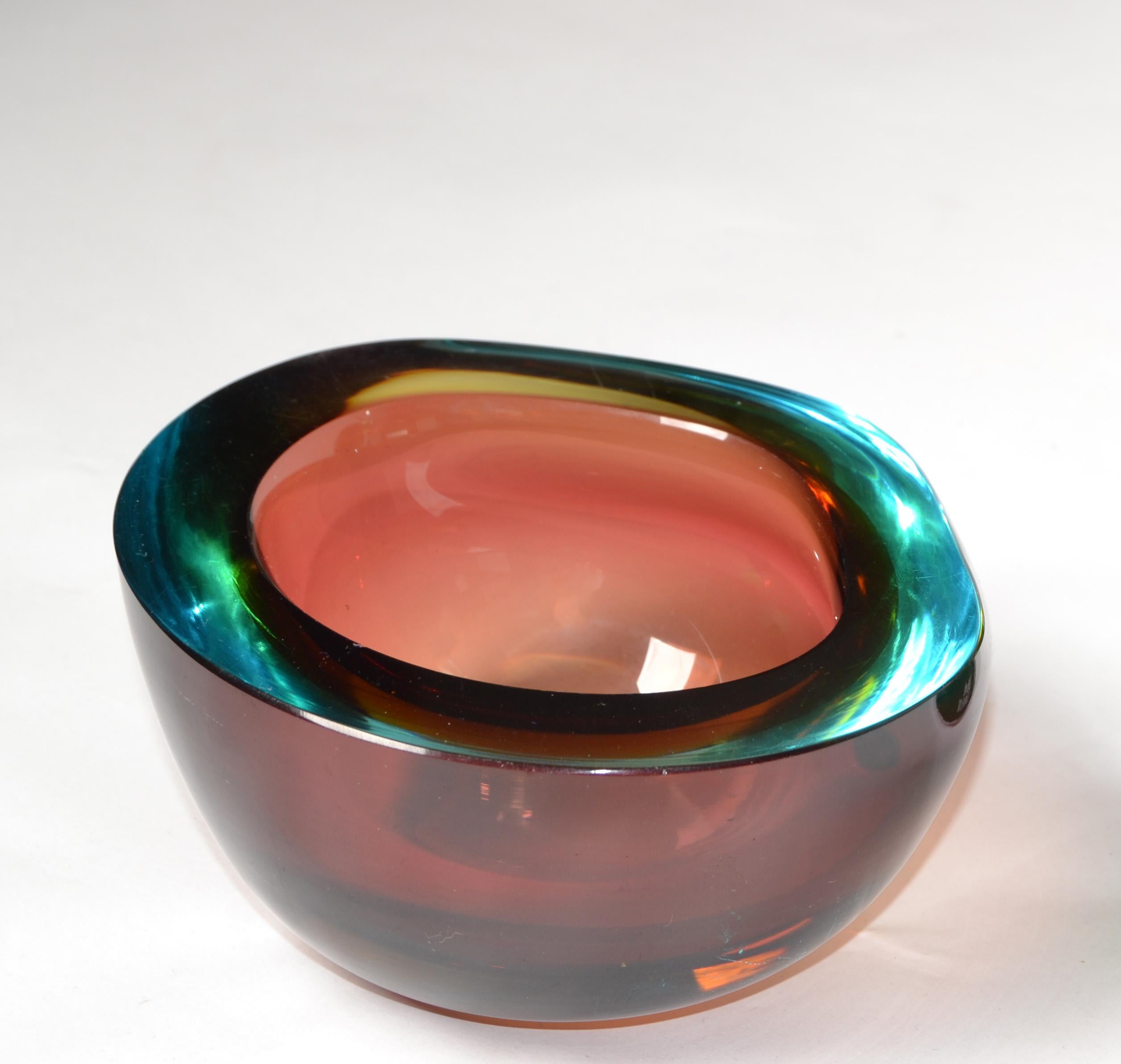 Mid-Century Modern Murano art glass bowl in amber and green, blown glass catchall, made in Italy.
Heavy glass bowl with outstanding details. Looks great on an entry Hallway Console Table, Sideboard or as a ring dish on Top of a Dresser.