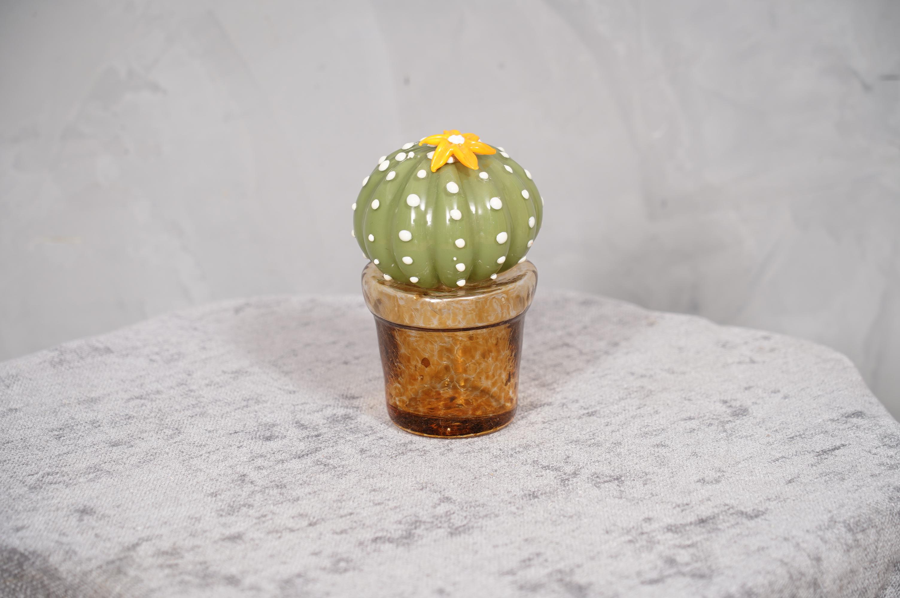 Italian design, this cactus is a fashion icon of the Italian style, green with a beautiful amber glass vase underneath.

In limited edition, manufactured in one of the furnaces in Venice, the cacti are in Murano glass have a vase in amber glass and