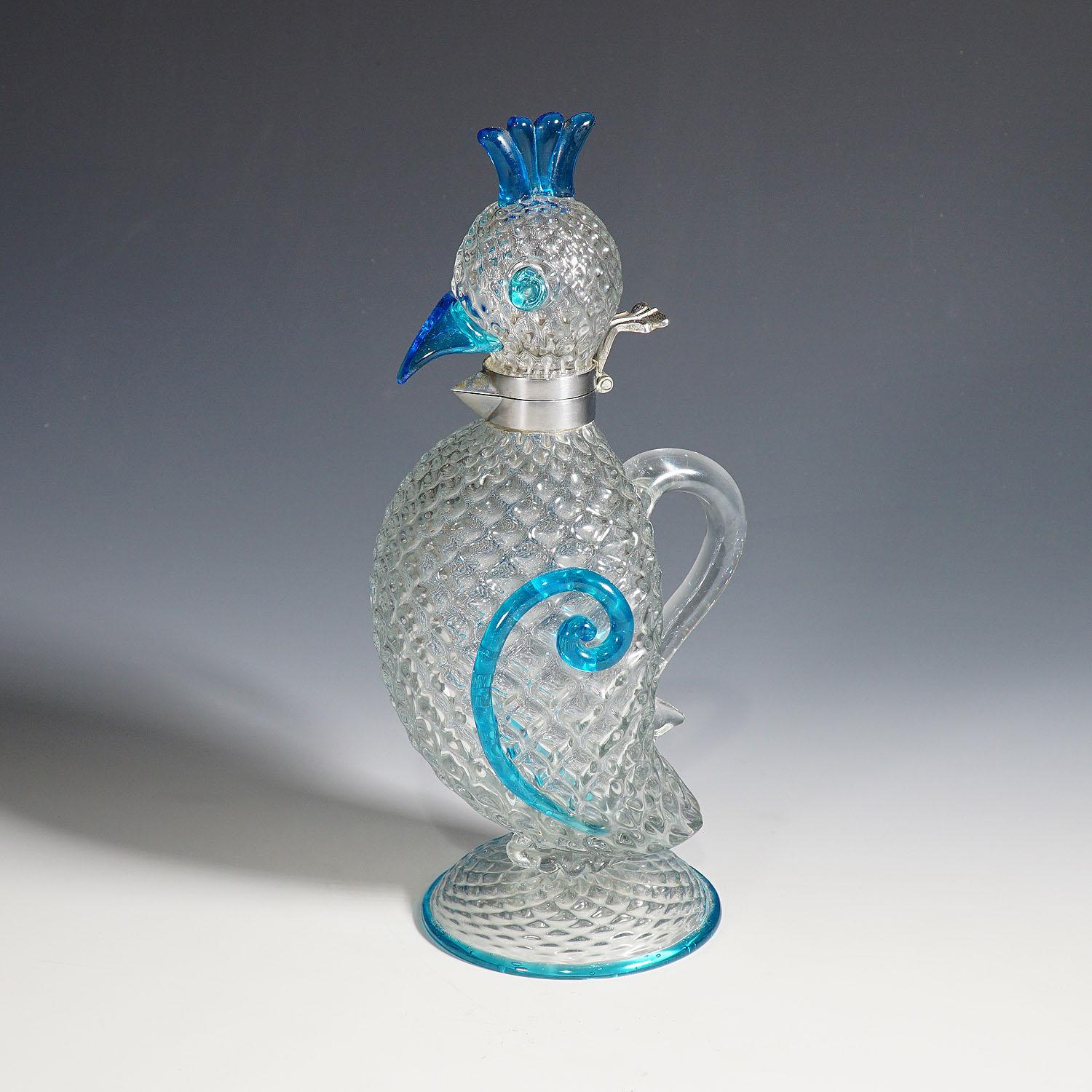 A Murano art glass jug designed by Flavio Poli for Seguso Vetri d'Arte ca. 1962. Cristallo antico glass with ribbed decoration and glass applications in aquamarine. Seguso model number: 13120. A rare authentic piece of Midcentury Modern Murano art