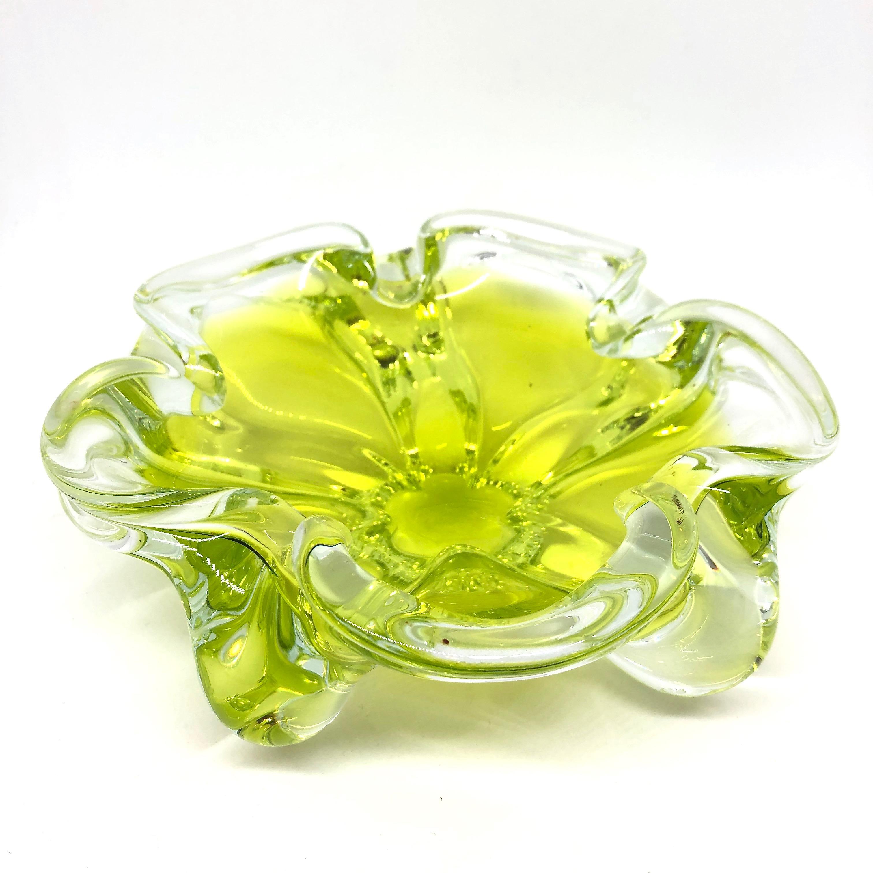 An amazing Venetian Murano glass object in an unusual design and a pretty beautiful lime green and clear color. A highly decorative piece useful as center piece, bowl, candy bowl or catchall. Italy, 1970s.