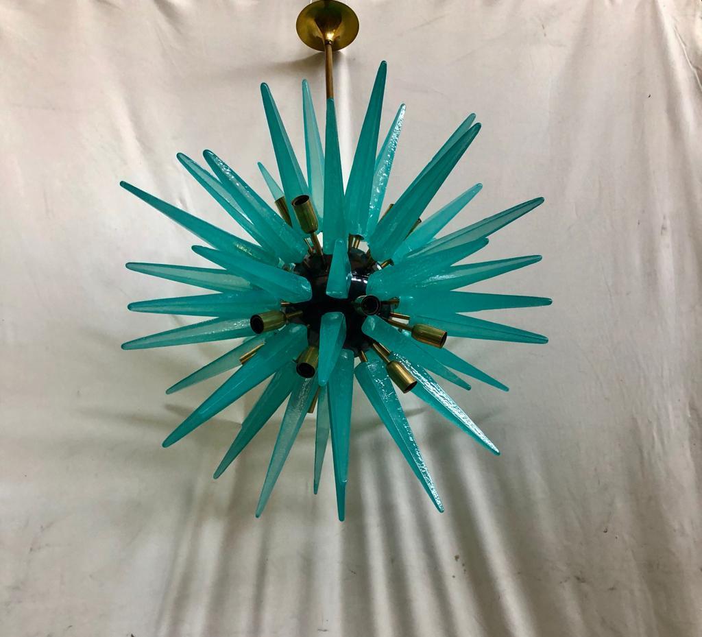 Something truly incredible this Murano chandelier. Surprising design from the 70s, due to the very particular shape of these large water green glass stalactites. Very elegant, it will furnish and decorate your entire room. The Murano furnaces create