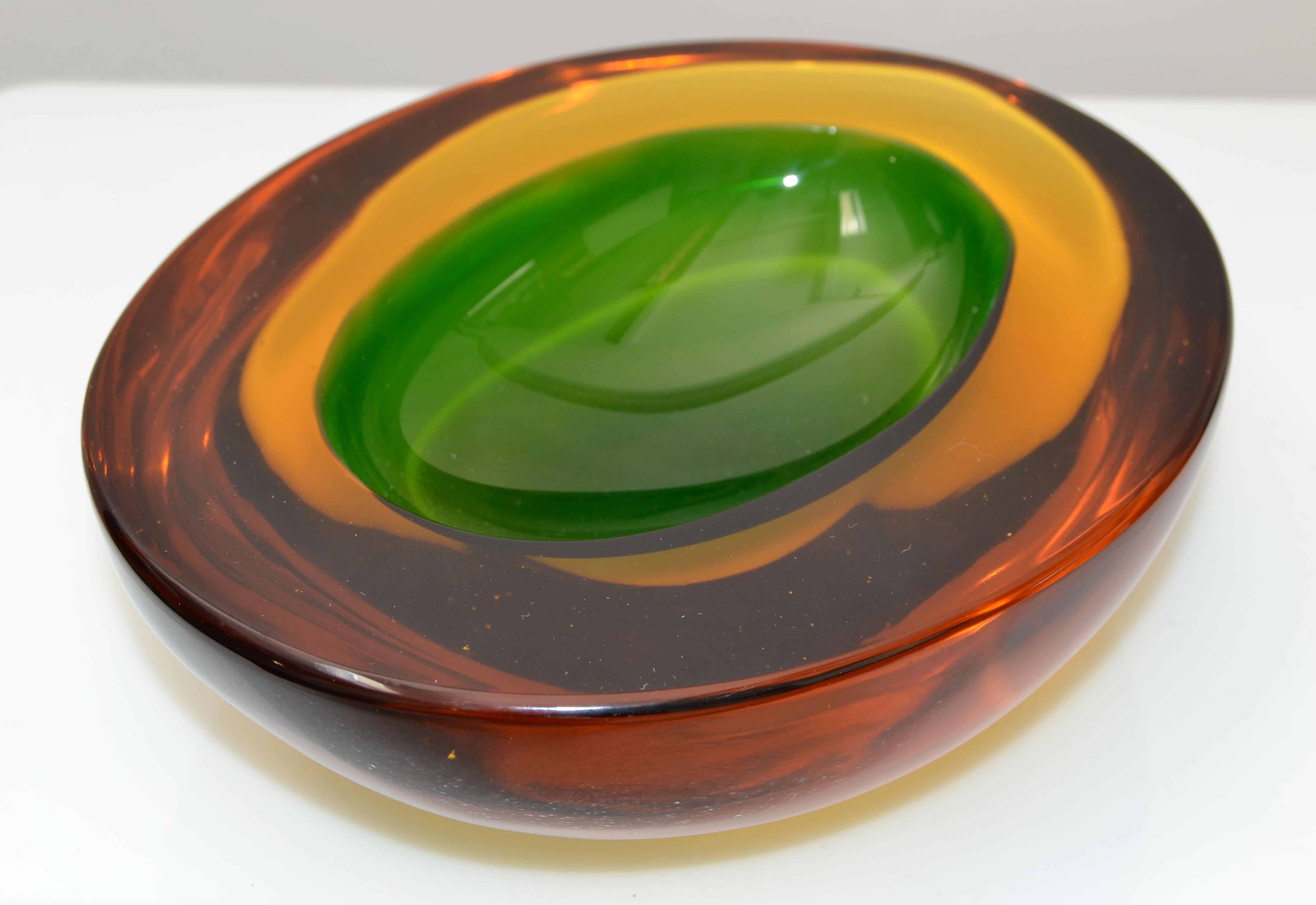 Mid-Century Modern Murano art glass bowl in red, orange and green, blown glass catchall, made in Italy.
Heavy glass bowl with outstanding details.