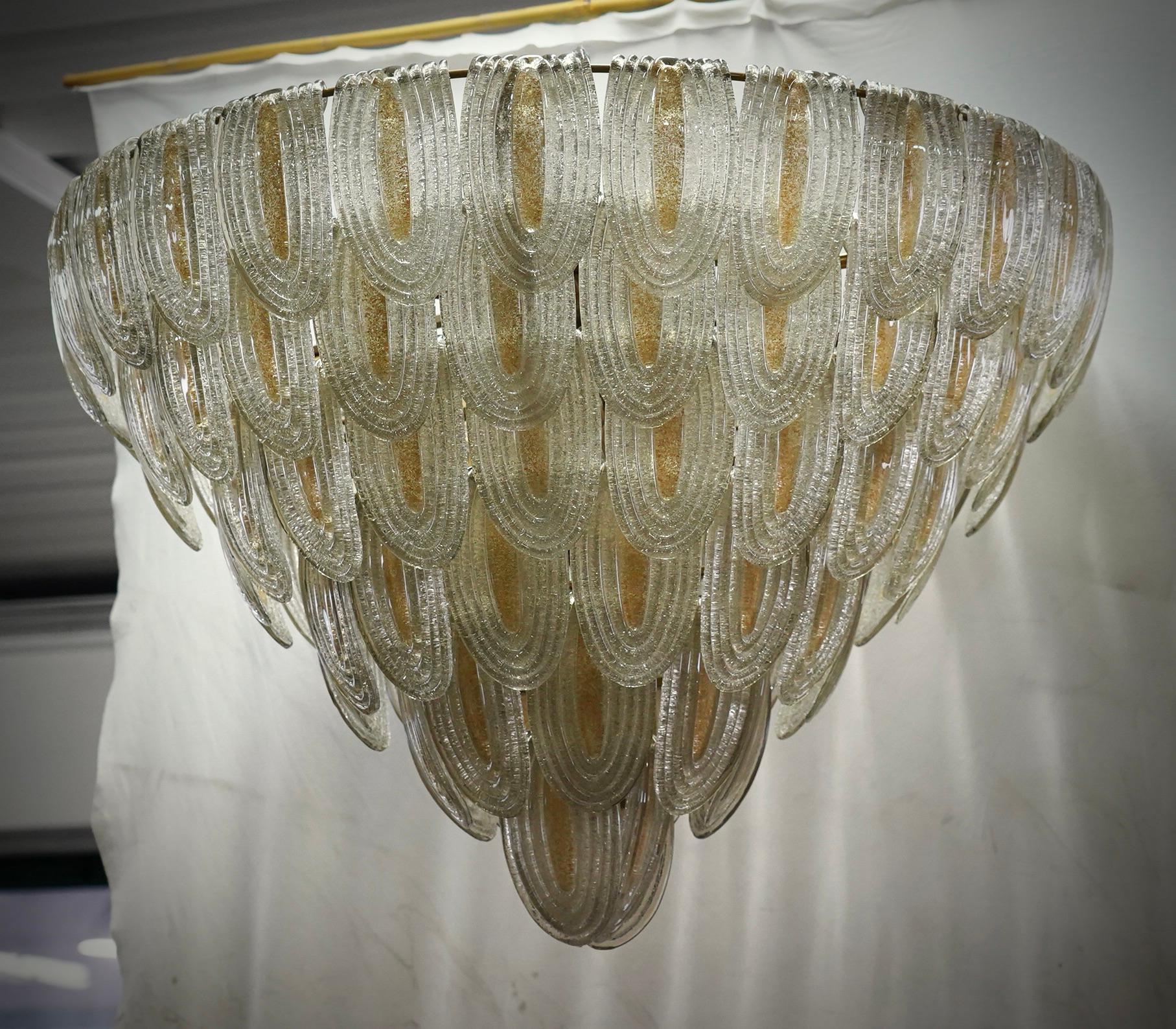 Fantastic Venetian gold and transparent color for a Cascade of Murano leaves. A striking color for this chandelier.

All in Murano art glass with gold leaves placed all around. The color of this very Classic Murano chandelier is very light gold with