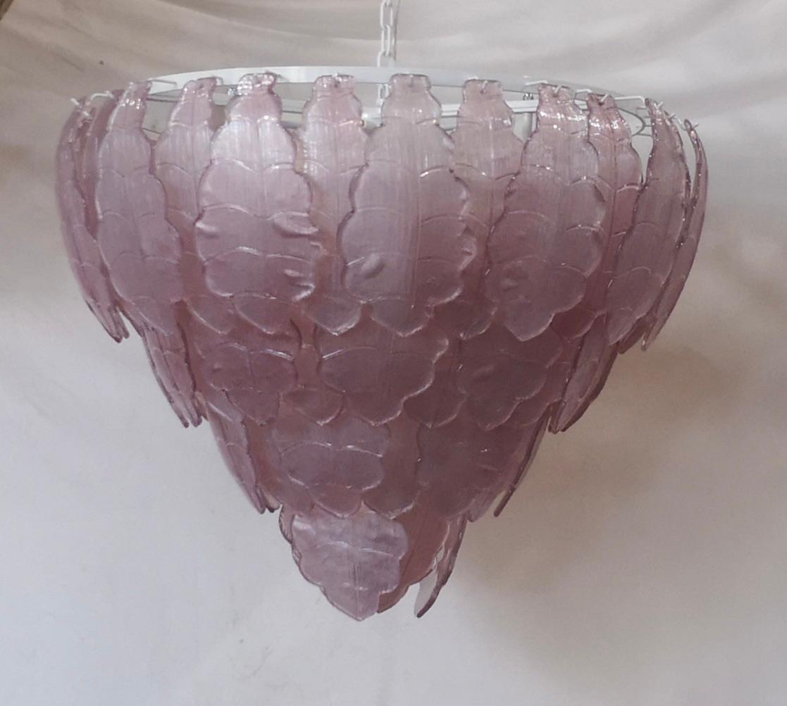 Fantastic Venetian pink color for a Cascade of Murano leaves. A striking color for this chandelier. The Murano furnaces create an indisputable timeless design, simple but elegant at the same time.

All in Murano art glass with pink leaves placed all