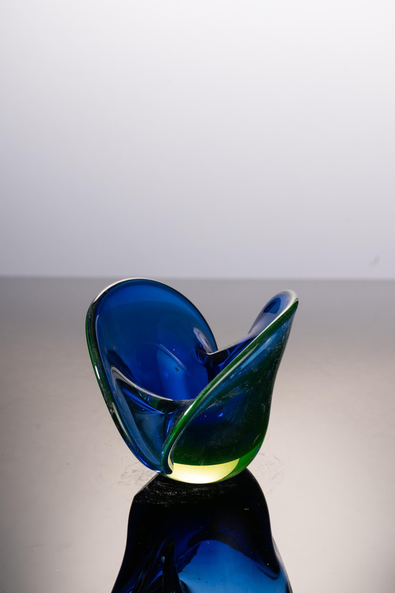 Very original deep blue Murano glass vase with a rounded design and a split top. The base and edges of this rare item have a light green tint.