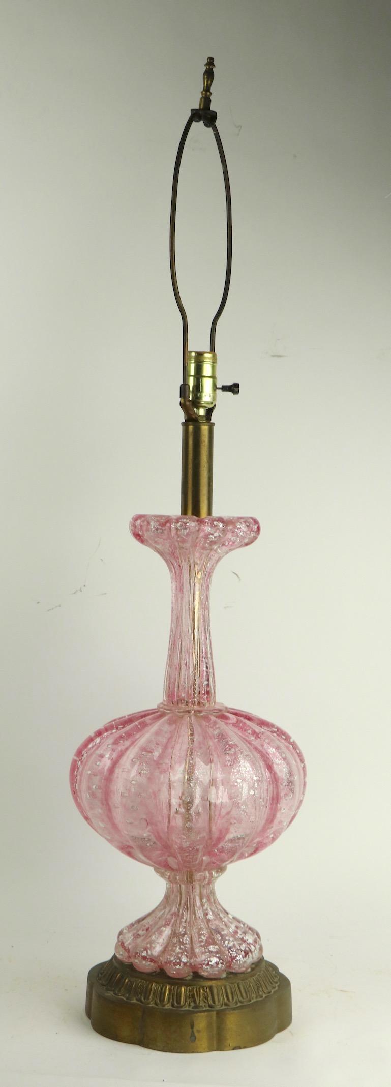 Classic Italian Murano art glass table lamp by Barovier. This example has a clear and pink glass body with silver foil flake inclusions. The lamp is in very fine, original and working condition, showing only light cosmetic wear to metal fitments as
