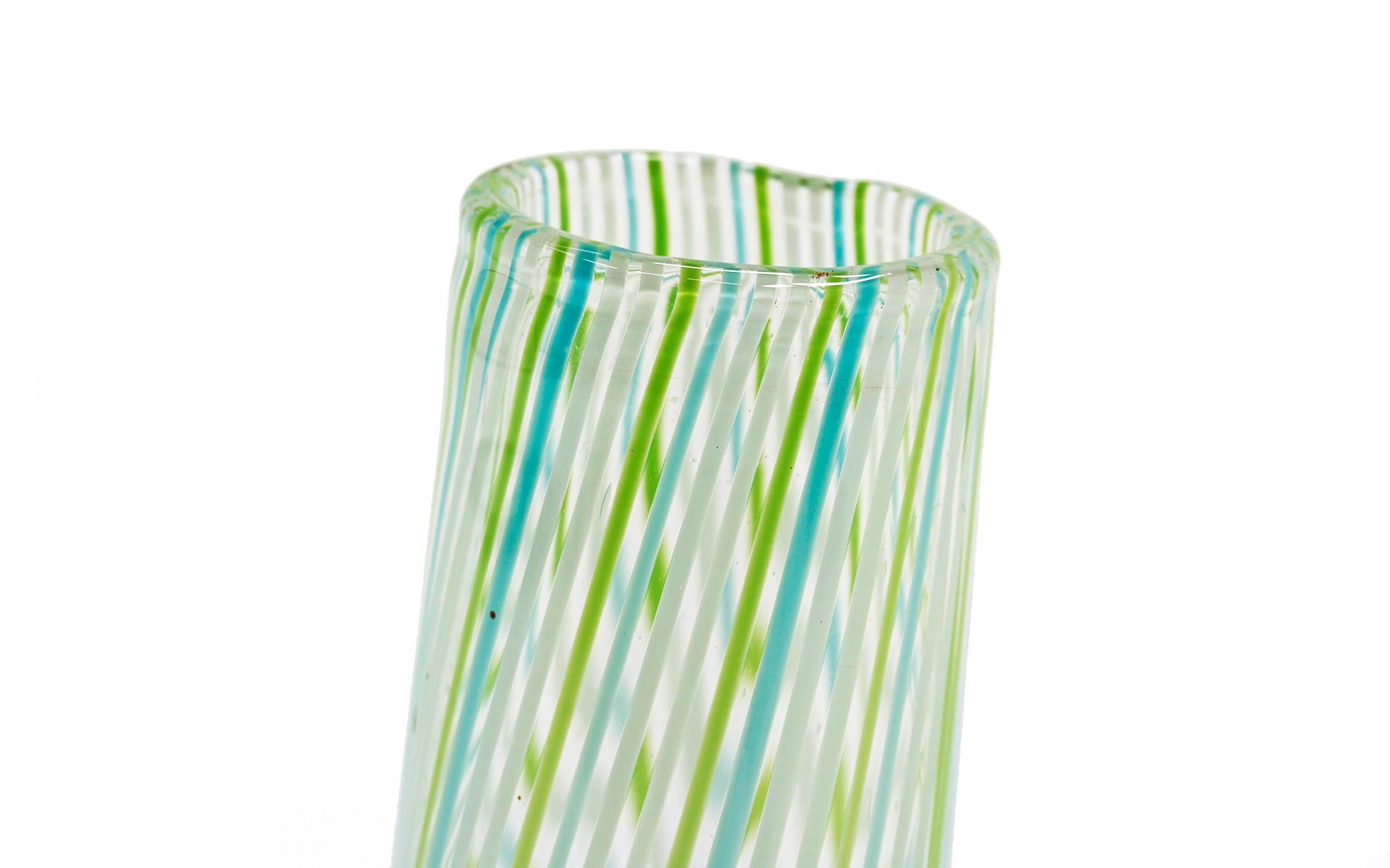 Art glass vase by Murano, Italy. Curved form with vertical stripes in green, blue, yellow, and white. Mint condition.