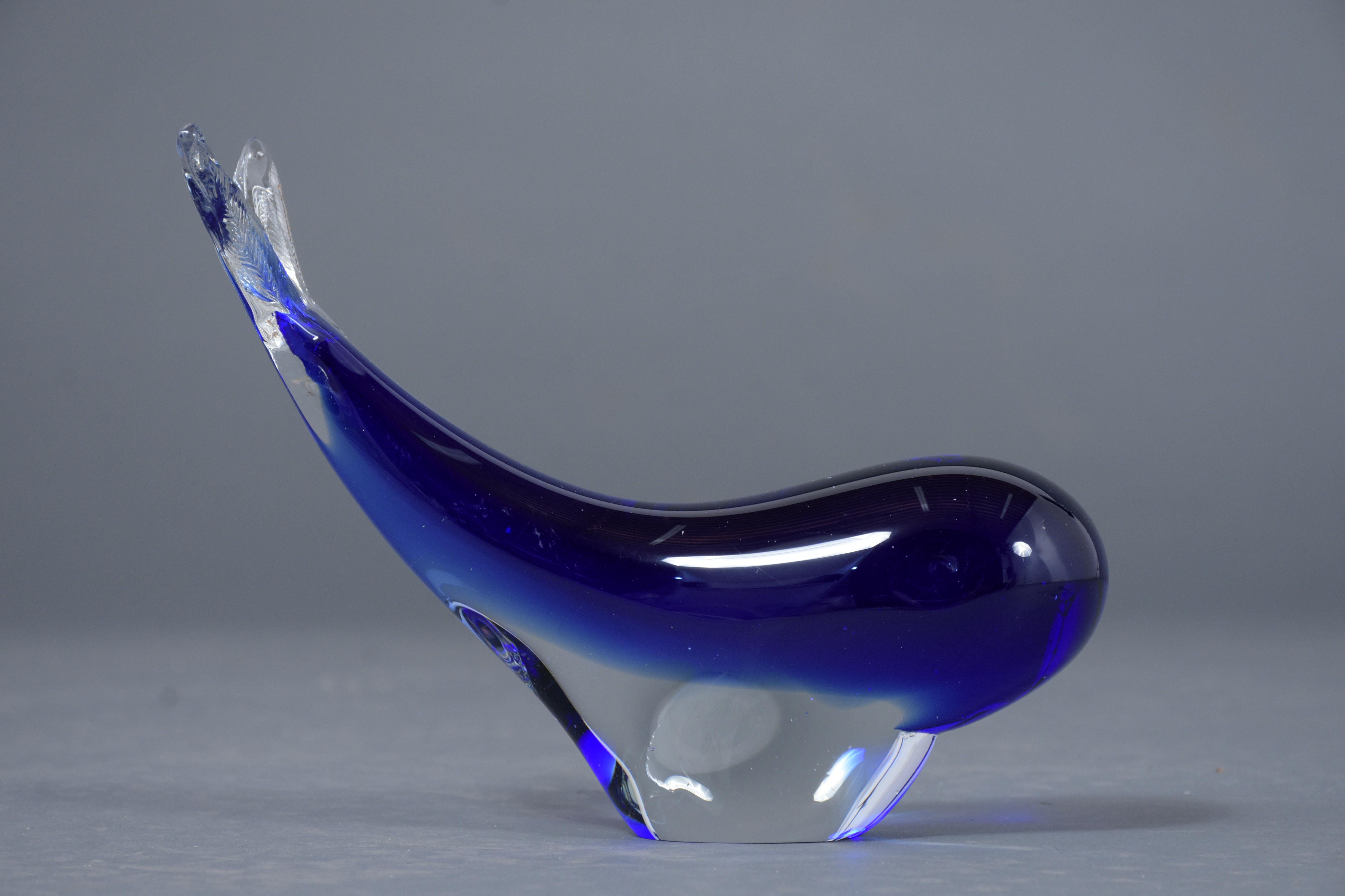 A beautiful Italian Murano Art Glass whale sculpture, this fabulous handcrafted art glass piece is eye-catching and ready to be displayed in sophisticated home decor.
