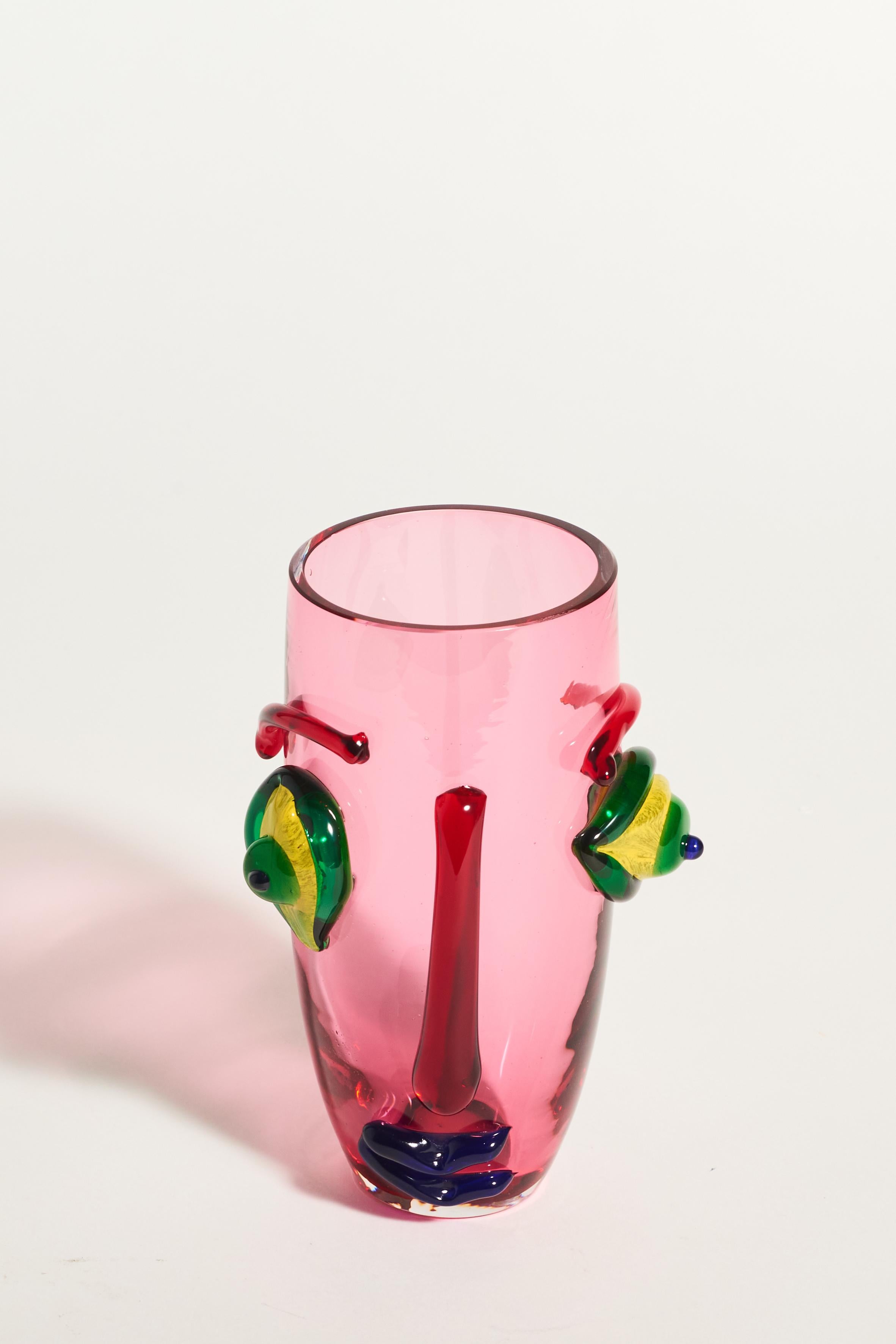 Italian translucent lipstick pink vase with Picassoesque abstract face in decorative applied glass, Murano artist signature on base.