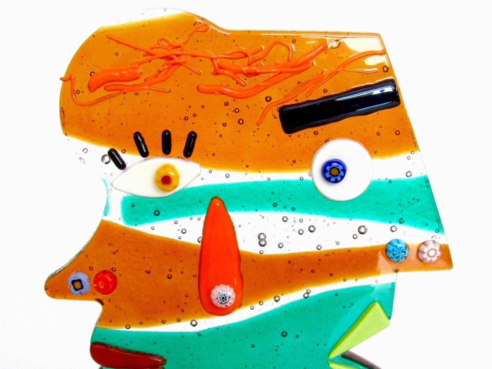 Murano Art glass two faces sculpture made in celebration to Picasso. The Hand crafted multi colored sculpture is signed by the Artist. The colors can appear to be more intense in different light conditions and angles. Measures approx. 7.5 inches at