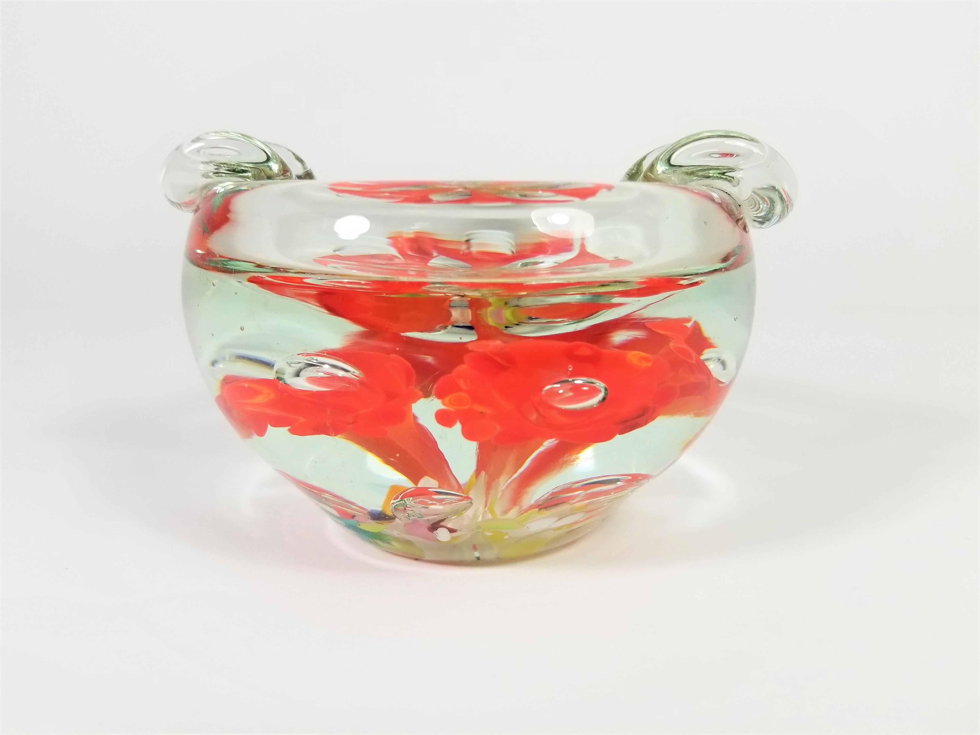 1960s midcentury Murano ashtray. Art glass multicolored blown glass.
Solid piece with substantial weight. Psychedelic flower design.
Excellent condition.