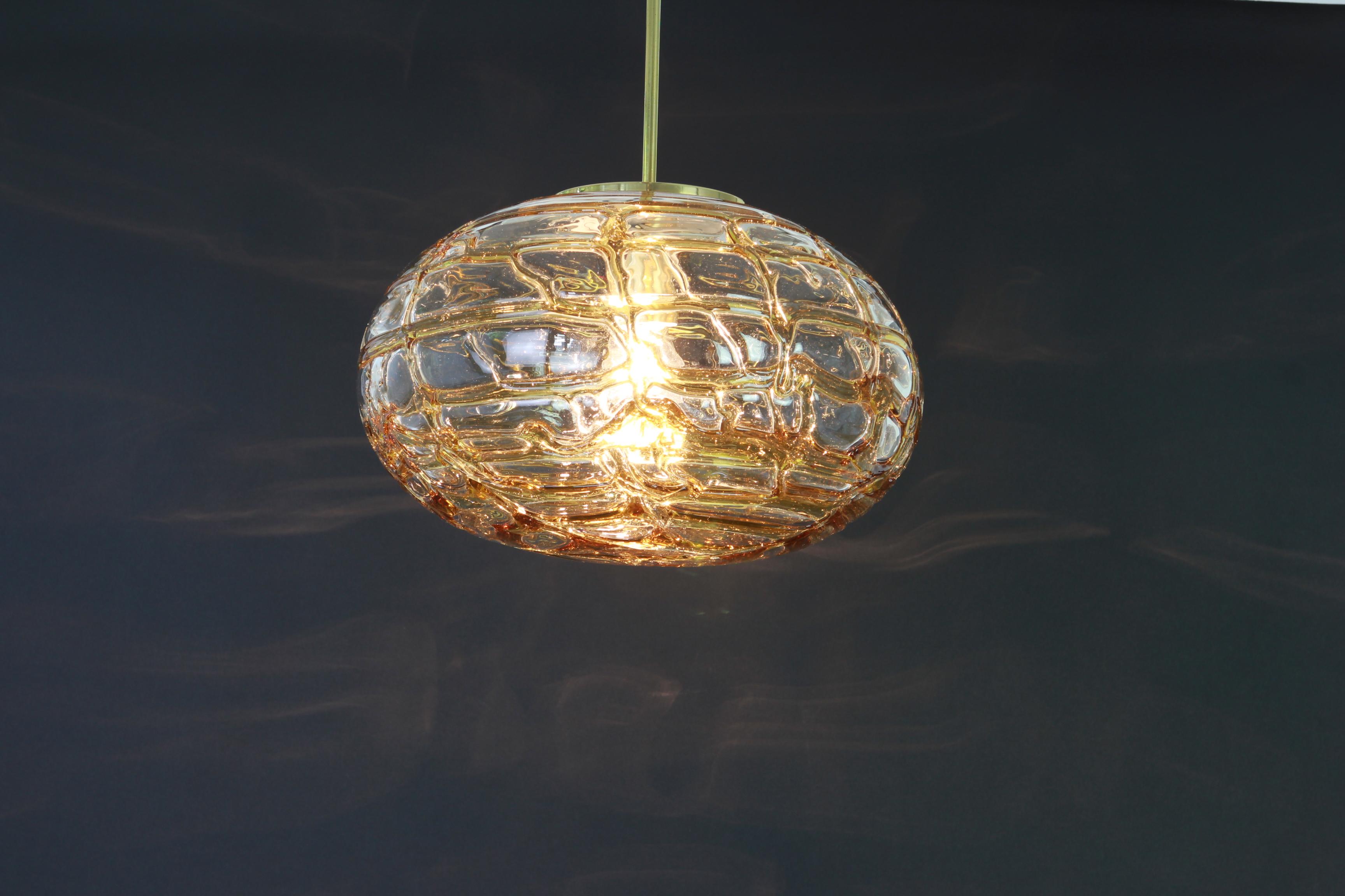 Doria ceiling light with large volcanic Murano glass ball.
High quality of materials, gives a wonderful light effect when it is on.

High quality and in very good condition. Cleaned, well-wired and ready to use. 

The fixture requires one