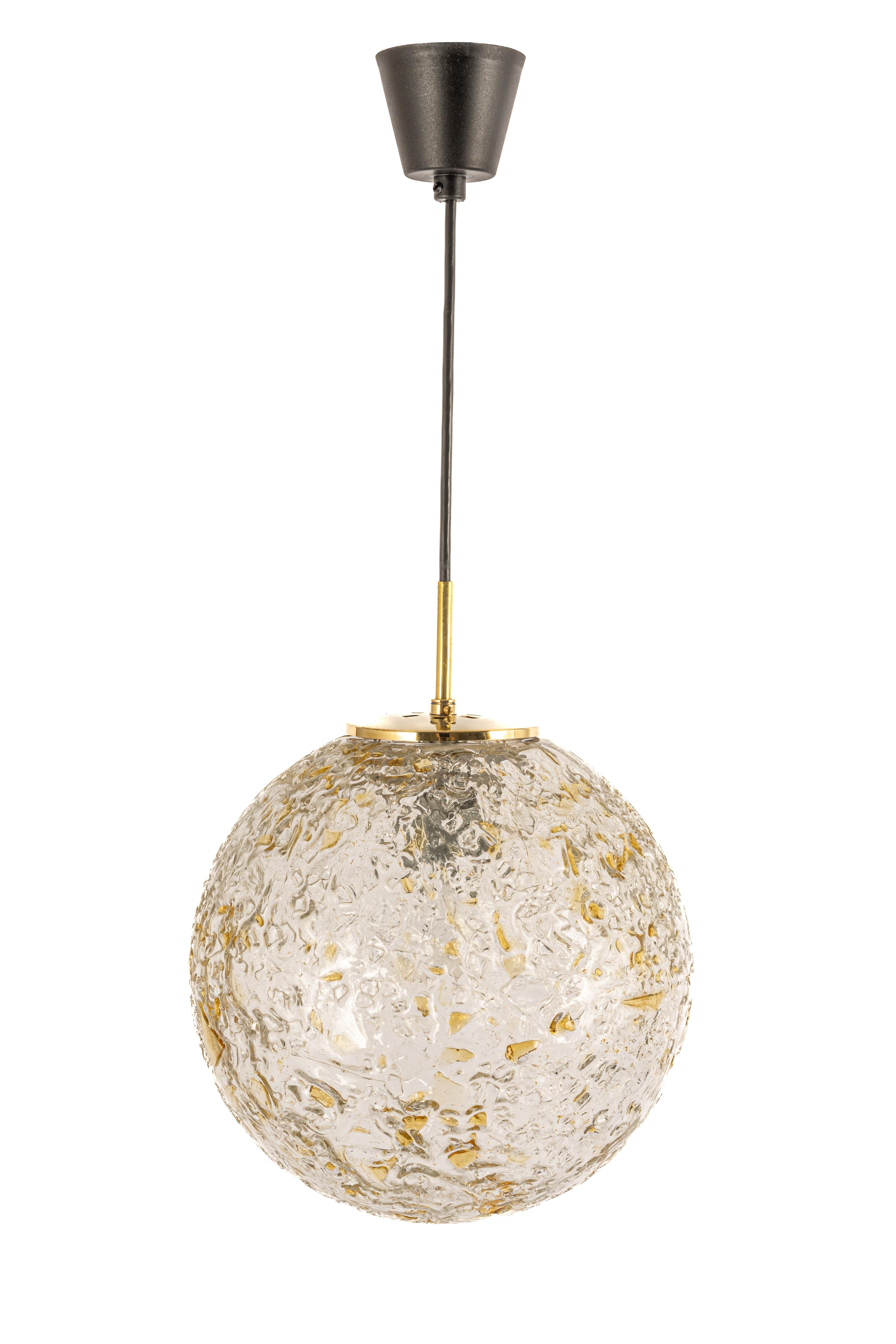 Doria pendant light with nice Murano glass ball.
High quality of materials, gives a wonderful light effect when it is on.
Very good condition. Cleaned, well-wired, and ready to use. 
The fixture requires one standard bulb (E-27)
Light bulbs are