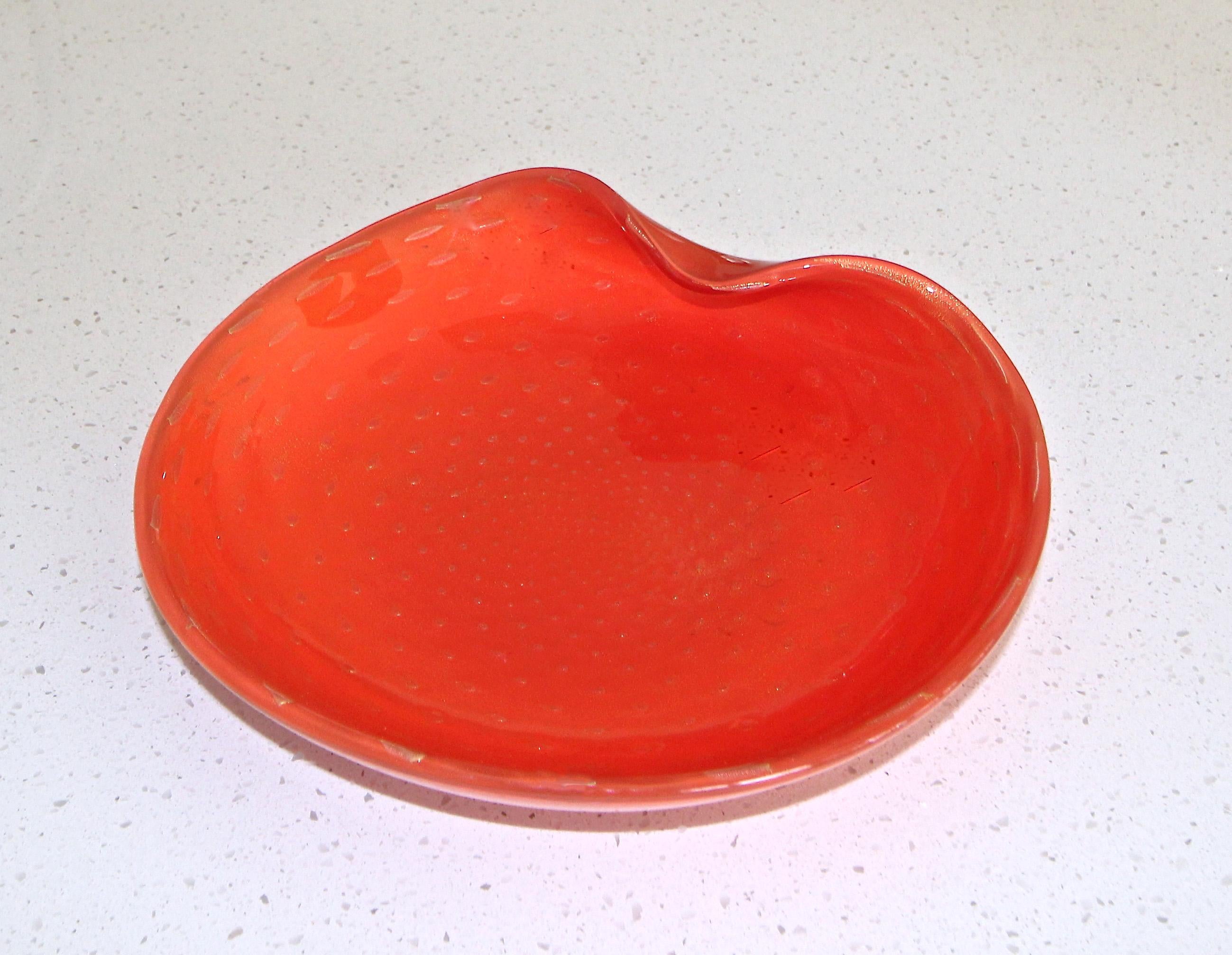 Large vintage Murano Italian handblown orange clam shape bowl or centerpiece by Alfredo Barbini. Inside the orange glass are gold inclusions and controlled bubbles.