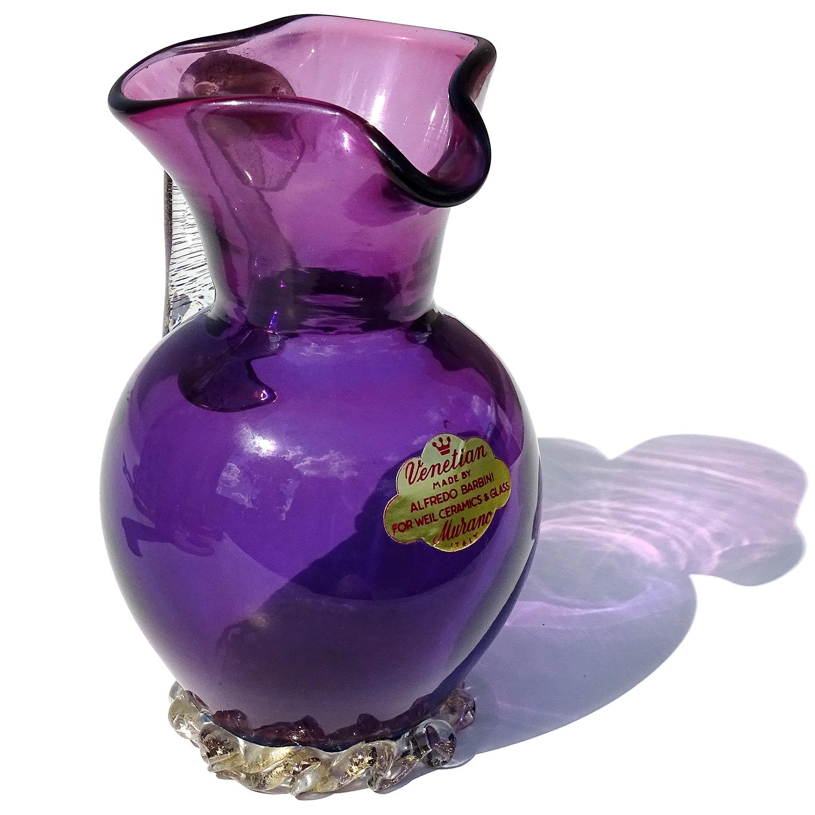 Beautiful vintage Murano hand blown amethyst purple and gold flecks Italian art glass pitcher shape flower vase. The piece is documented to designer Alfredo Barbini, with original and intact 