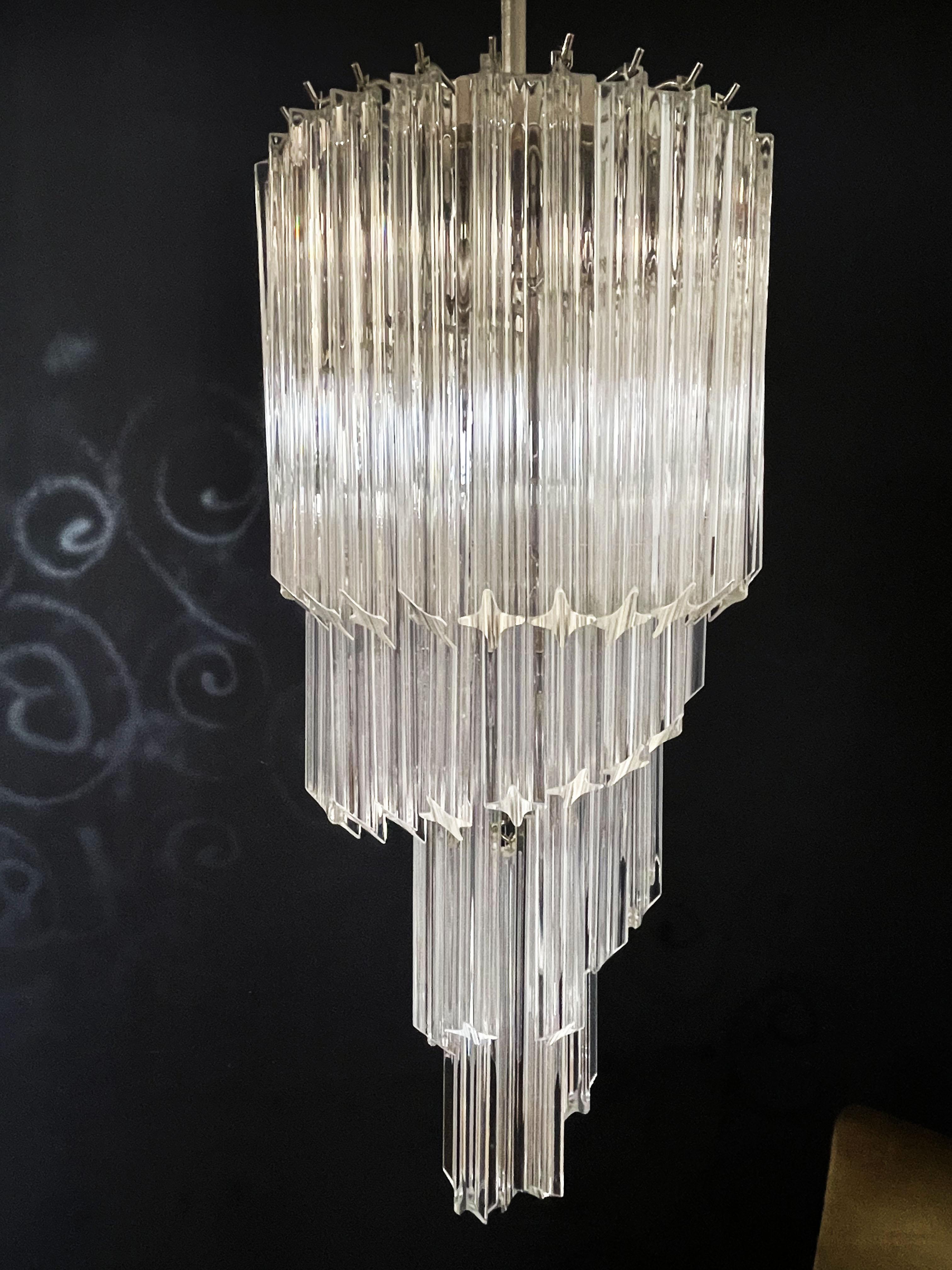 Fantastic and big Murano chandelier made by 54 Murano crystal prism (quadriedri) in a chrome metal frame. The shape of this chandelier is spiral.
Period: 1980s-1990s
Dimensions: 63 inches height (160 cm) with chain, 35.45 inches height (90 cm)