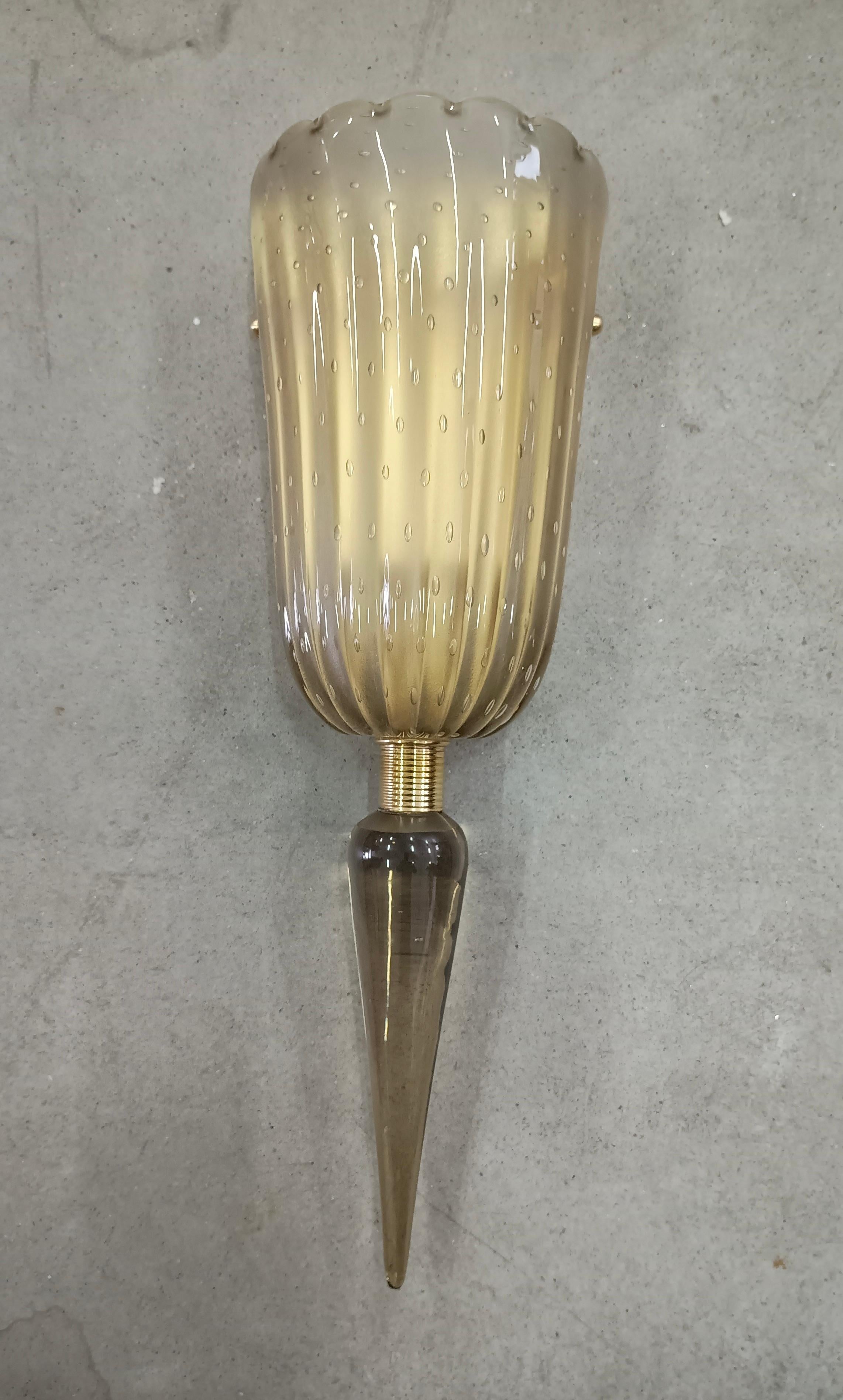 Refined and delicate design for this smoky Murano glass wall light with 