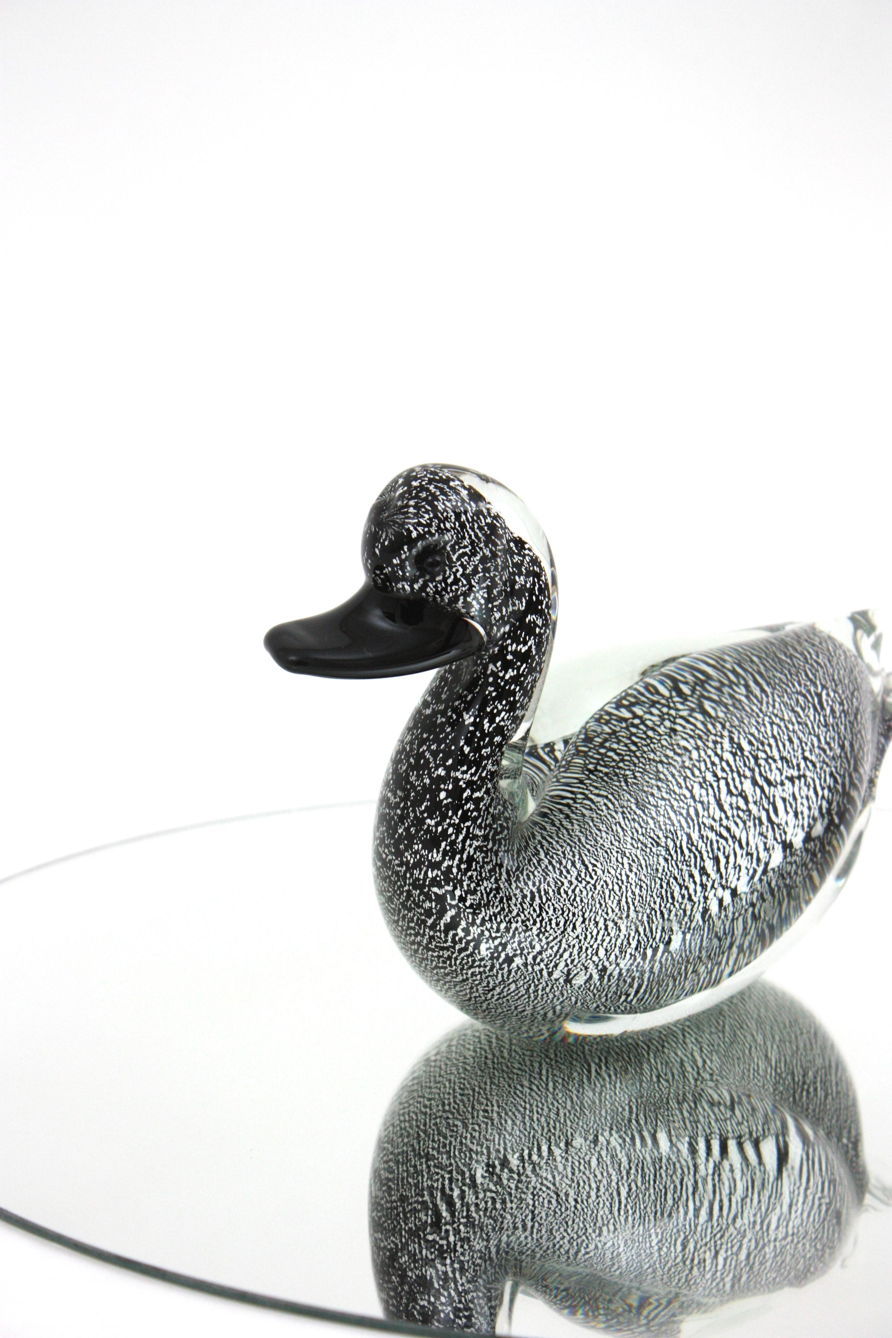 Eye-catching Murano glass duck figure / paperweight / sculpture. Manufactured by Formia Murano, Italy, 1960s.
Black glass and clear glass richly decorated by silver flecks thorough.
Large size.
Mint condition.
Lovely to use as a decorative sculpture