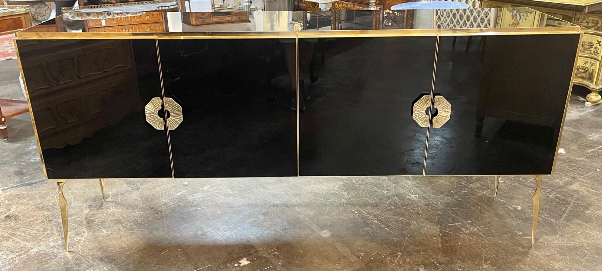 Modern Murano black glass and brass sideboard. Circa 2000. Perfect for todays transitional designs!