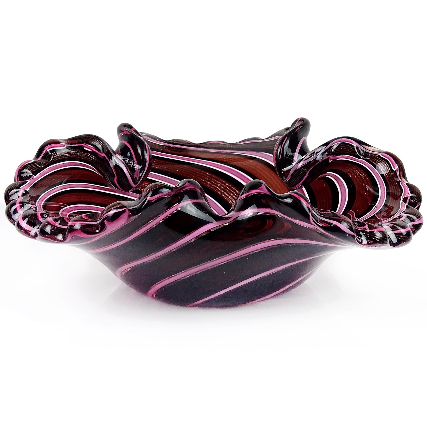 Only 1 Left! Beautiful vintage Murano pink, black and dark wine color with copper aventurine ribbons Italian art glass decorative bowl. It has a crimped rim with three folds along the edge. The bowl still retains the original 