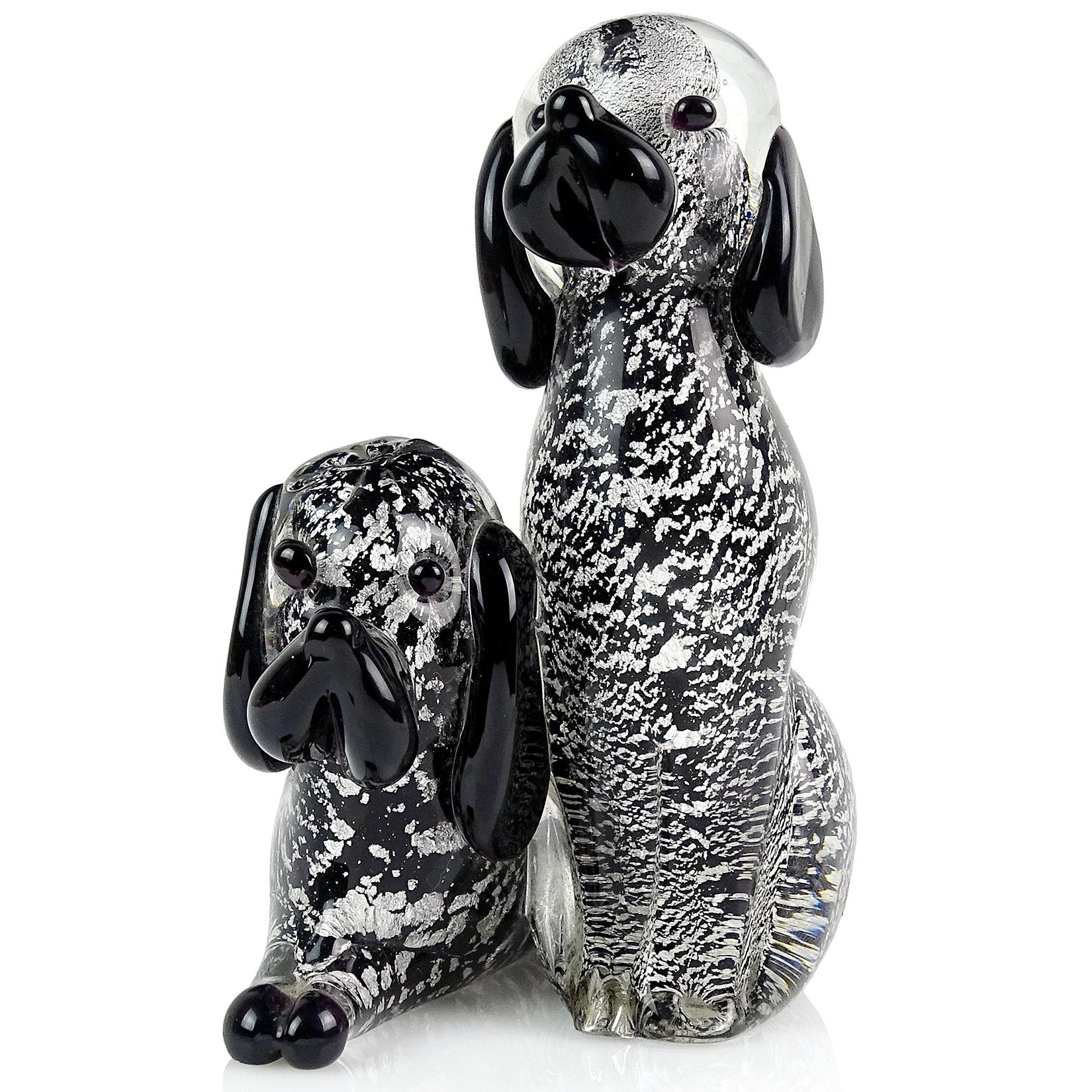 Beautiful vintage Murano hand blown black and silver flecks Italian art glass double puppy dog sculpture / figurine. The figure has 2 dogs attached to each other. Underneath there are 2 labels. One label reads 