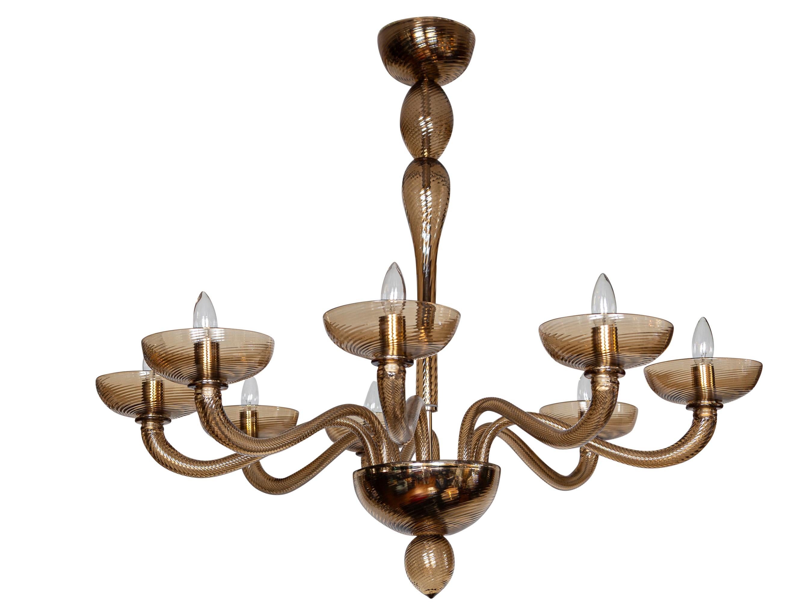 A wonderful unique custom designed Murano uplight chandelier consisting of soft arching shapes with each piece, mouth blown in a uniform twisting torchere creating a lovely swirl effect and capturing a much greater reflection of light  and play of
