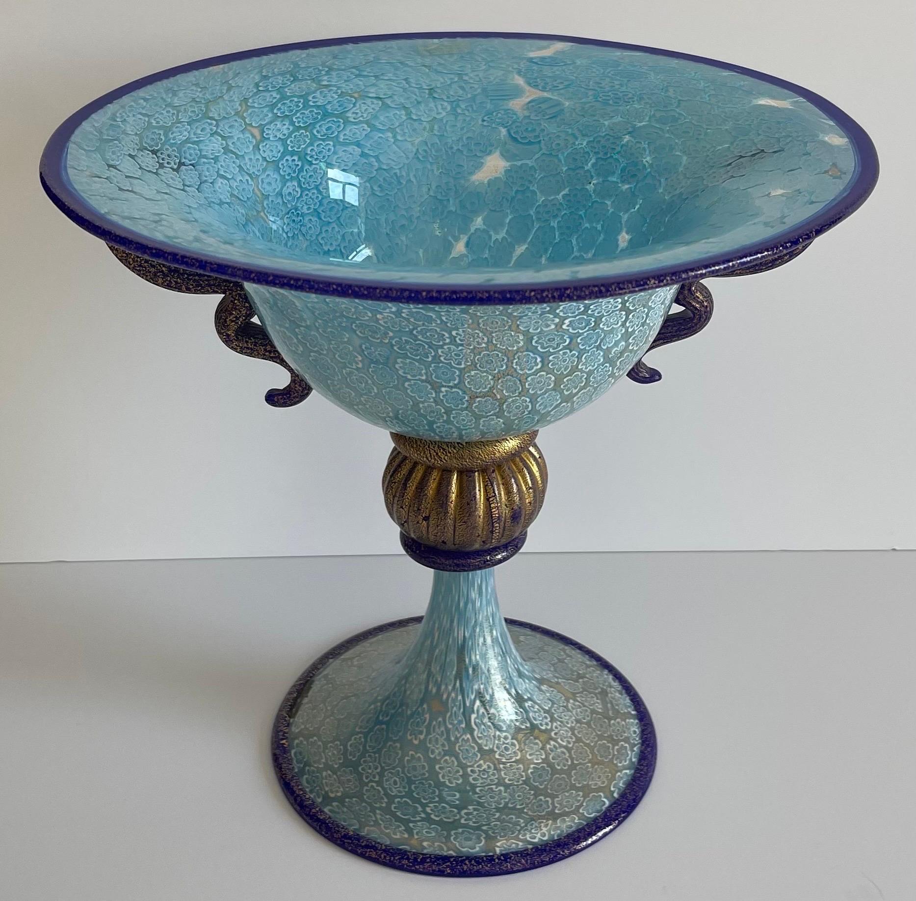 Murano Gambaro & Poggi sky blue blow glass millefiori footed bowl. Curvy cobalt blue blown glass handles. Gold swirled flecks throughout. Gambaro & Poggi brand sticker.