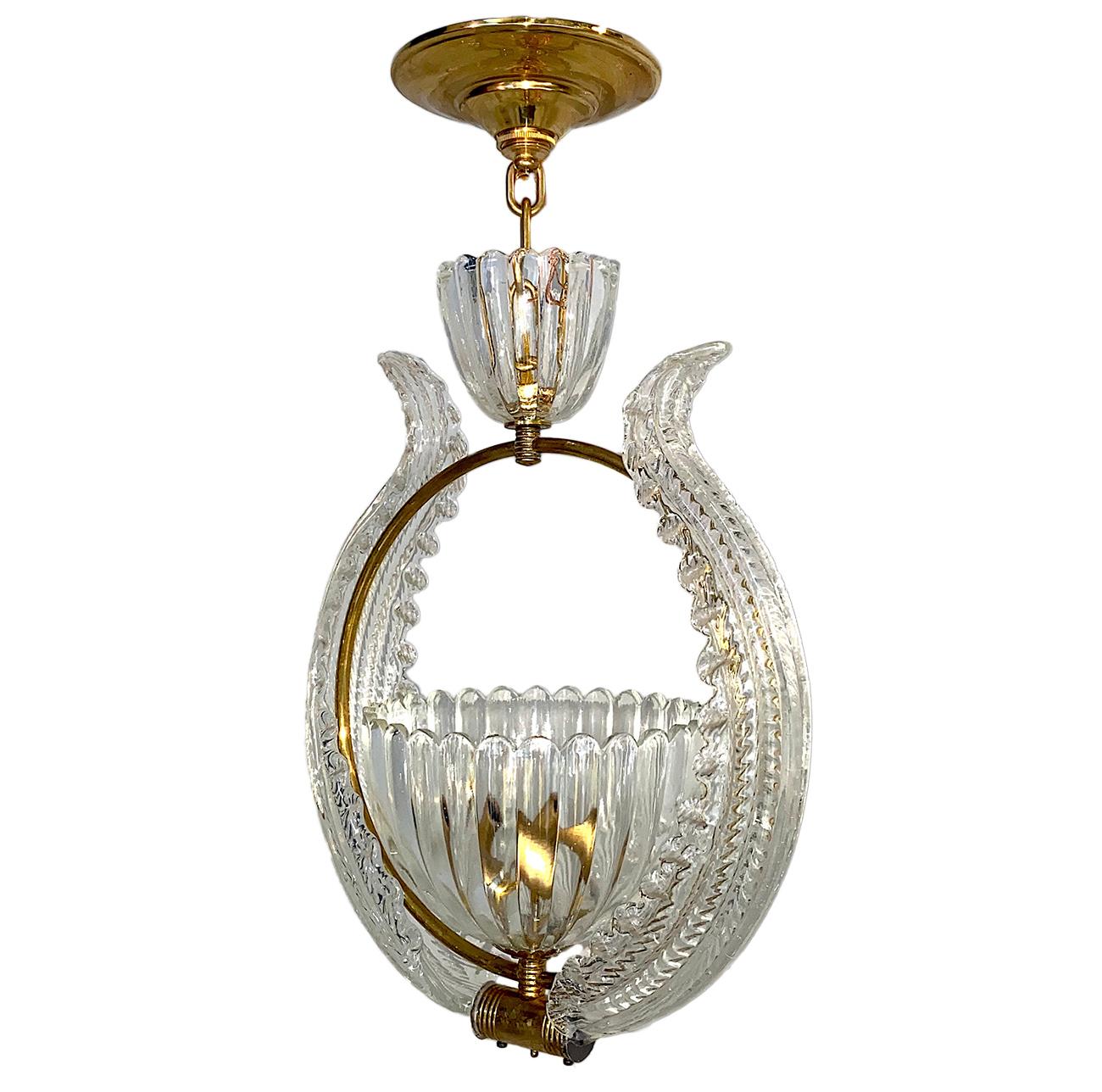 A circa 1940s Italian blown glass light fixture with two interior candelabra lights.

Measurements:
Drop 18.5