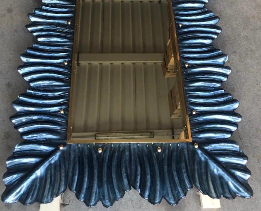 A strong blu color frame, reach the eye of the beholder, leaving him entranced; of Murano blu art glass wall mirror. Beautifully shaped and of excellent size, the wall mirror is a real design object.

The structure of the wall mirror is in wood,