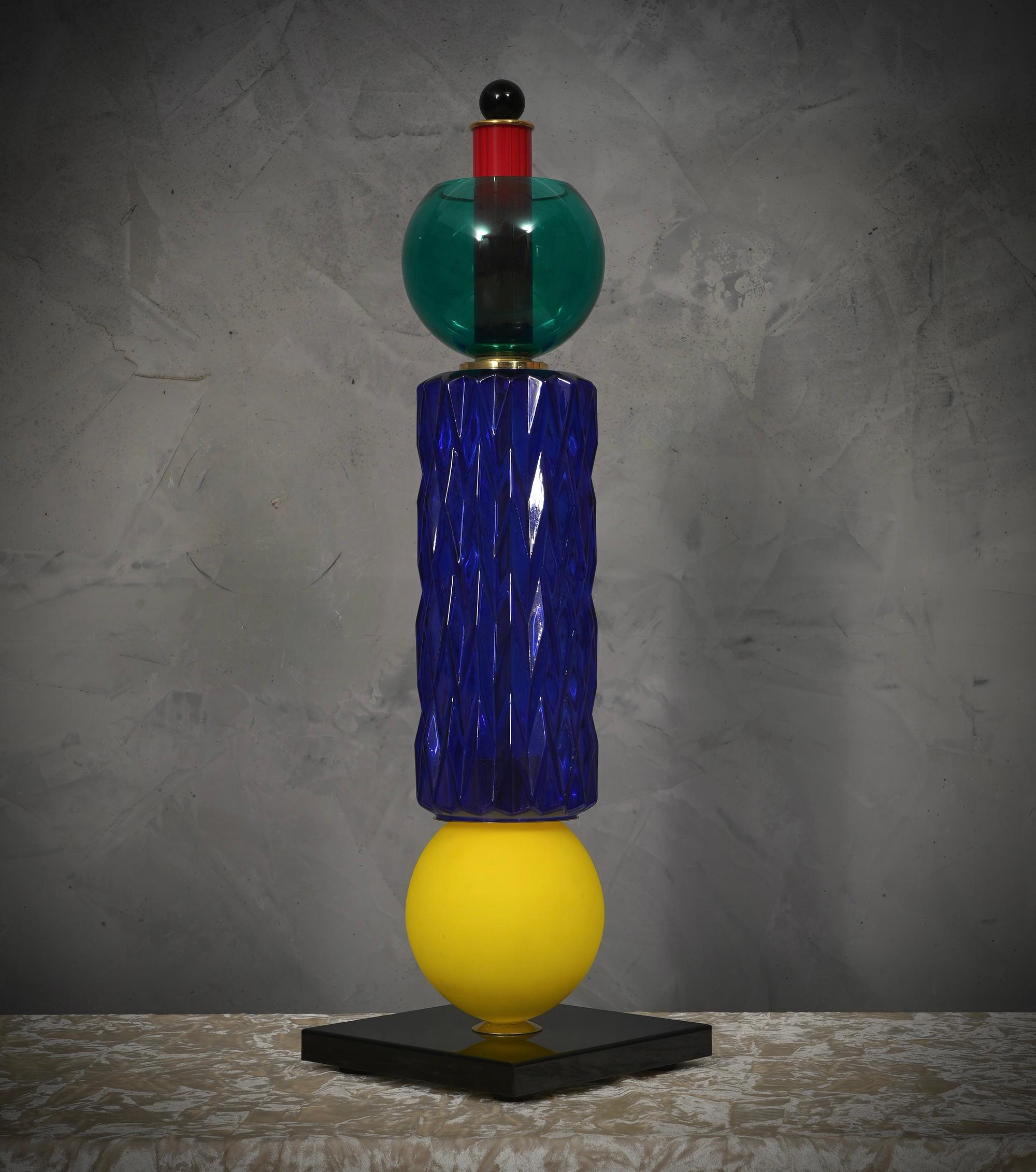 Precious and unique hand-blown multicolored Murano lamp, classic but original design with a strong contrast between the colors of the various glass pieces.

The lamp is characterized by an elegant, refined and linear design. It is composed of a