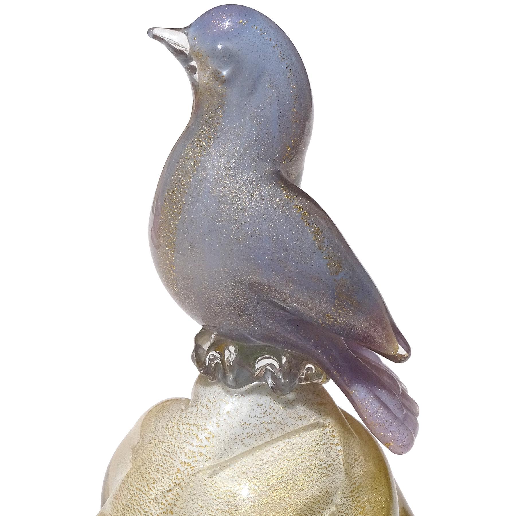 Beautiful vintage Murano hand blown blue purple, and gold flecks Italian art glass bird figurine on paperweight pedestal. Created in the manner of the Salviati company and Alfredo Barbini. The bird flows in color, Ombre style, with main blue body