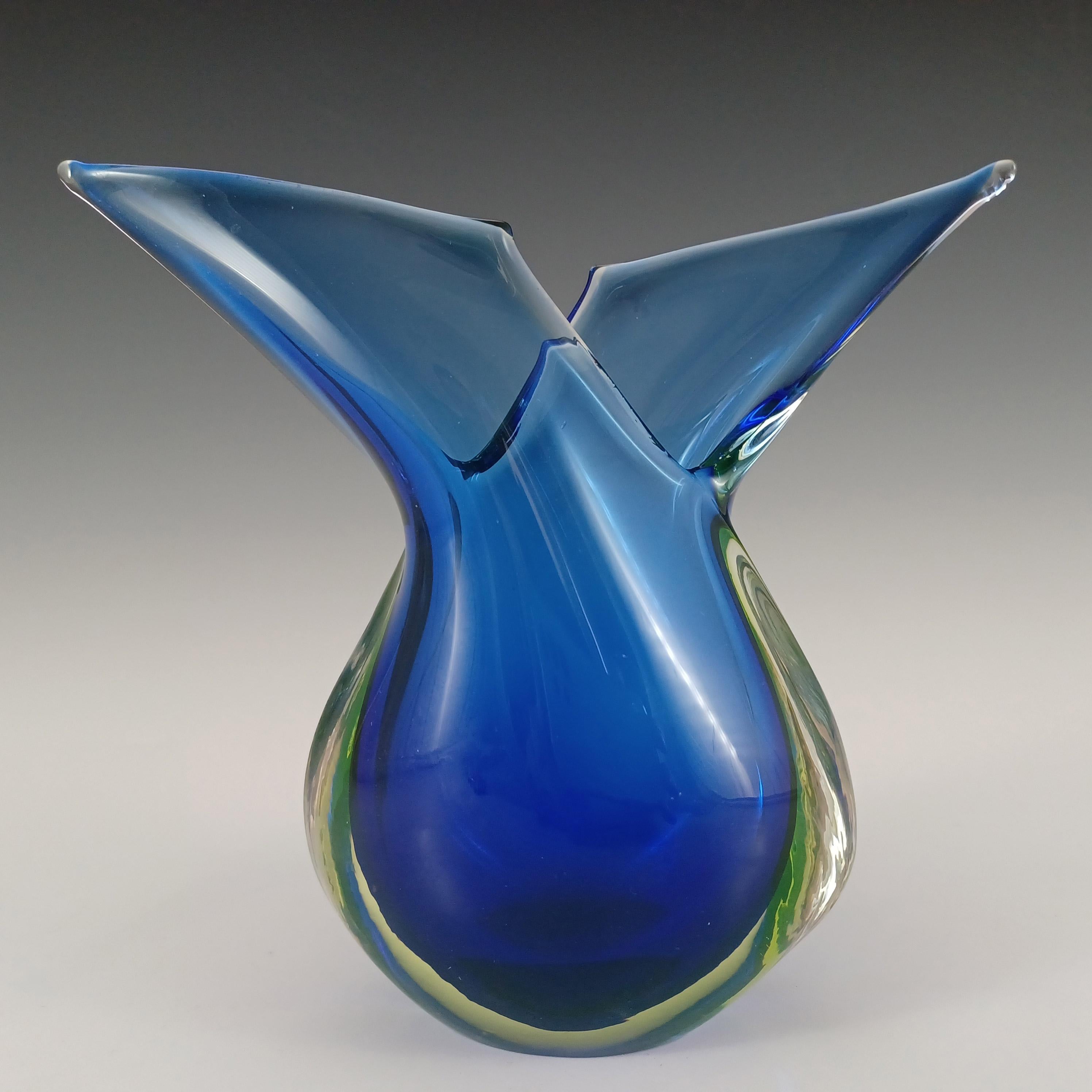 Here is a wonderful Venetian organic glass vase, made on the island of Murano, near Venice, Italy. In a stunning combination of blue glass cased in uranium yellow green glass, which is further encased in clear glass, using the renowned Venetian