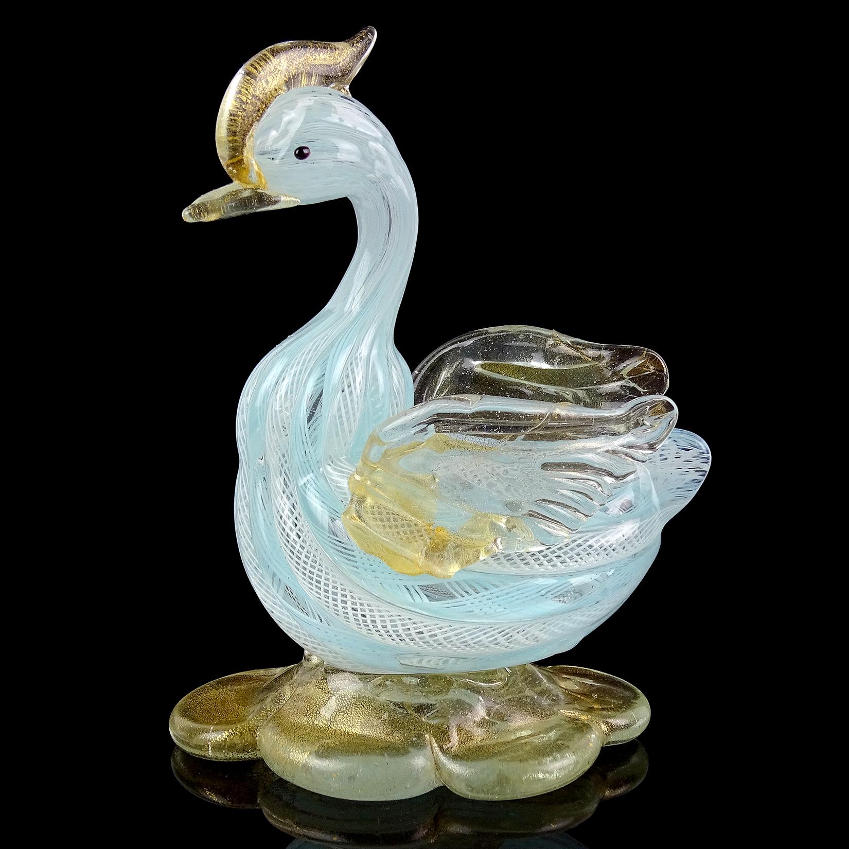 Beautiful, and cute, vintage Murano hand blown blue and white Italian art glass bird or duck sculpture. The figurine has a nicely sculpted body and features. Made with white and blue twisting Zanfirico ribbons. The bird sits on a large base, with