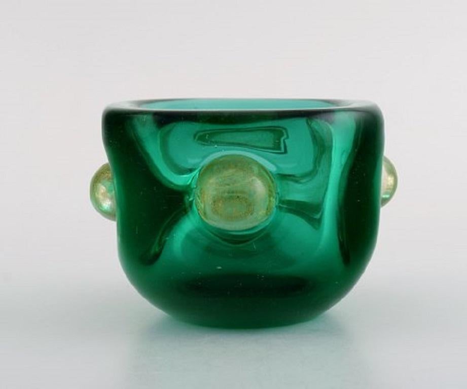 Murano bowl in green and gold-colored mouth-blown art glass. Italian design, 1960s.
Measures: 12 x 8.2 cm.
In perfect condition.