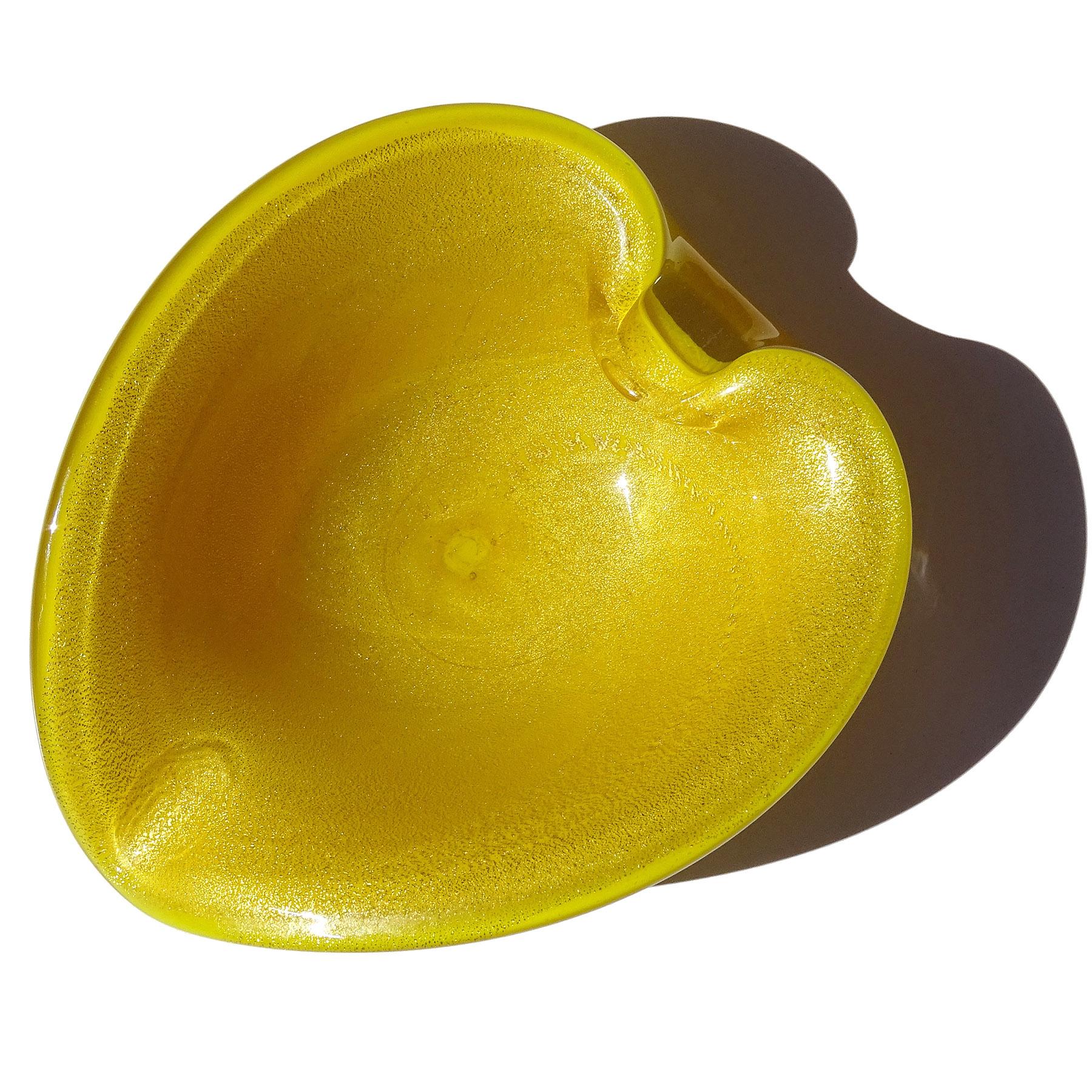 Beautiful vintage Murano hand blown bright yellow and gold flecks Italian art glass heart shaped bowl / vide poche. Attributed to designer Alfredo Barbini. The bowl I made with a golden sunflower yellow and it is profusely covered in heavy gold leaf