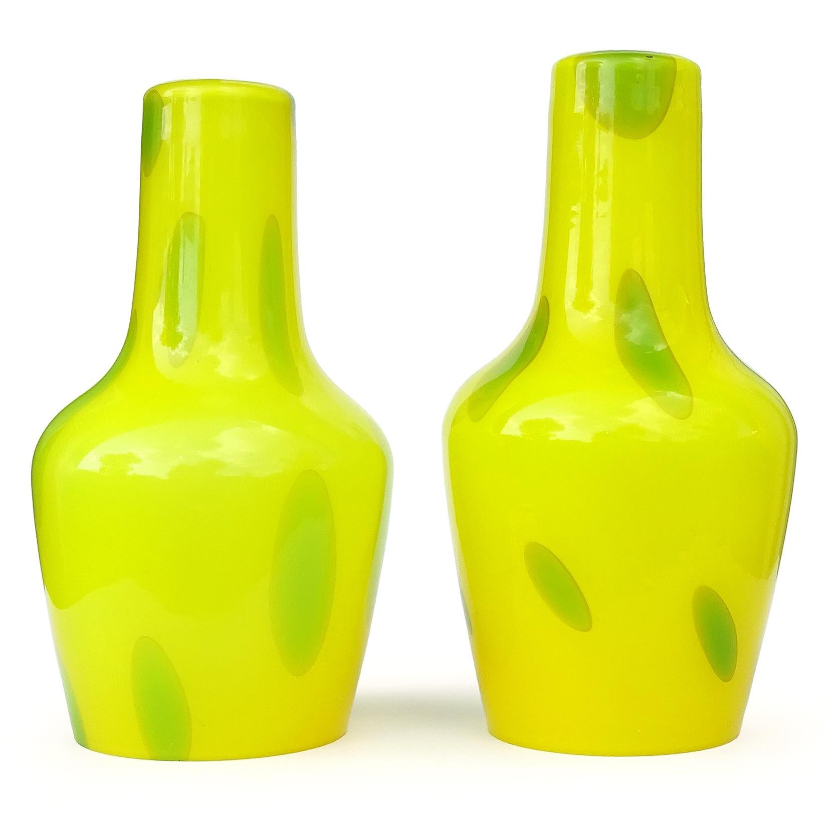 Beautiful pair of vintage Murano hand blown yellow with green spots Italian art glass hanging pendant lamp shades. Gives a great pop of color to any room. In the manner of the Vistosi company, circa 1970s. The inside is lined with a very thin layer